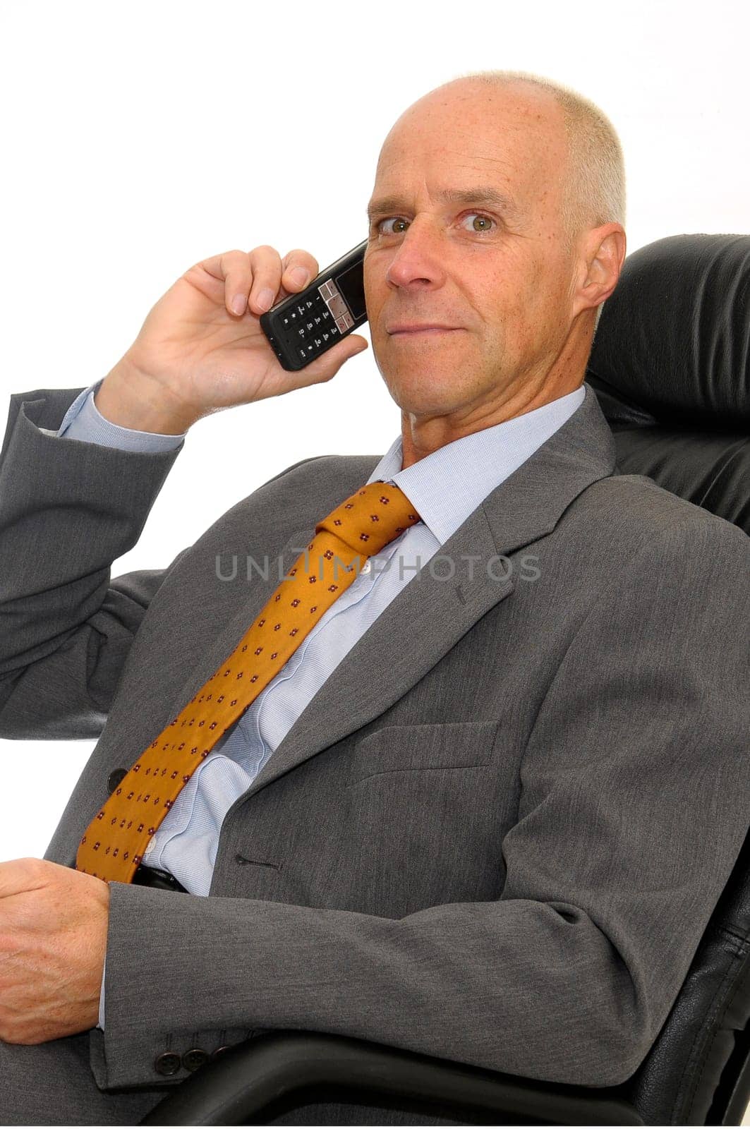 Mature man with cellphone isolated in white