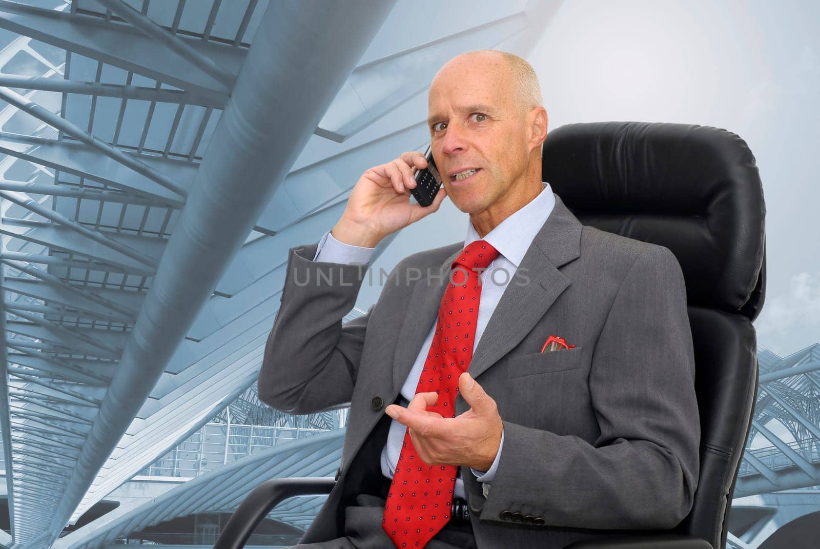 Businessman in a chair making a call