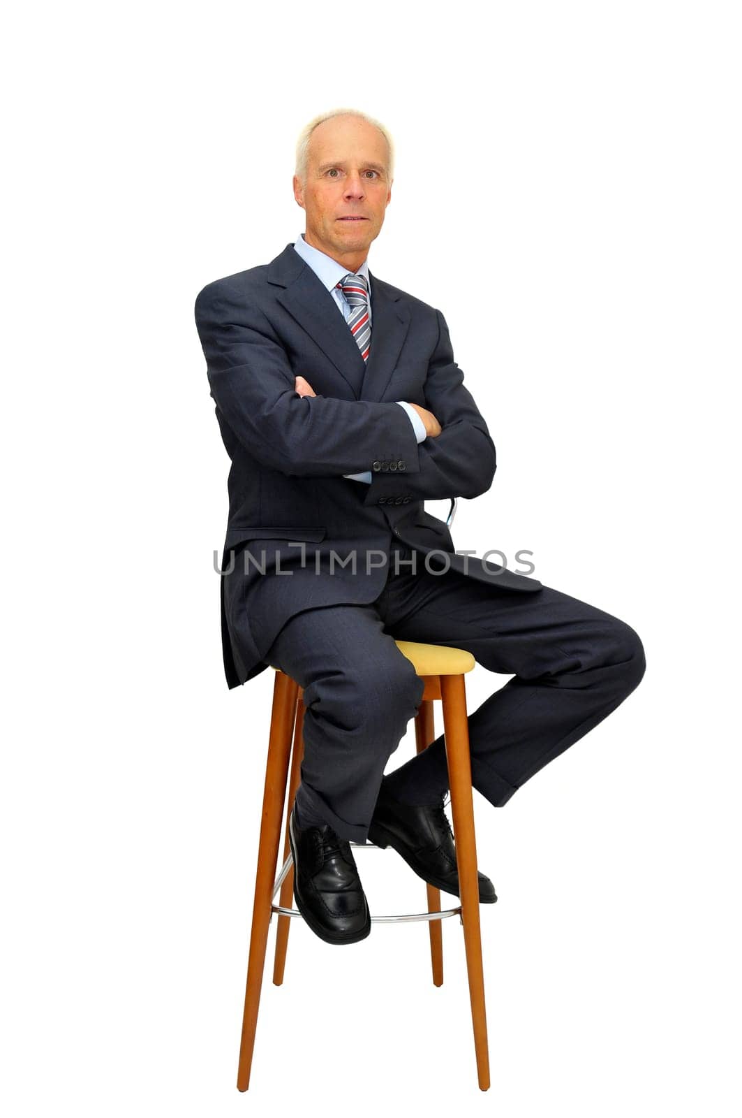 Businessman in a chair isolated in white