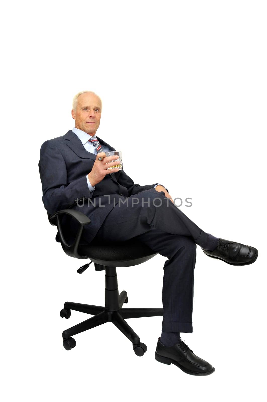 Businessman in a chair isolated in white