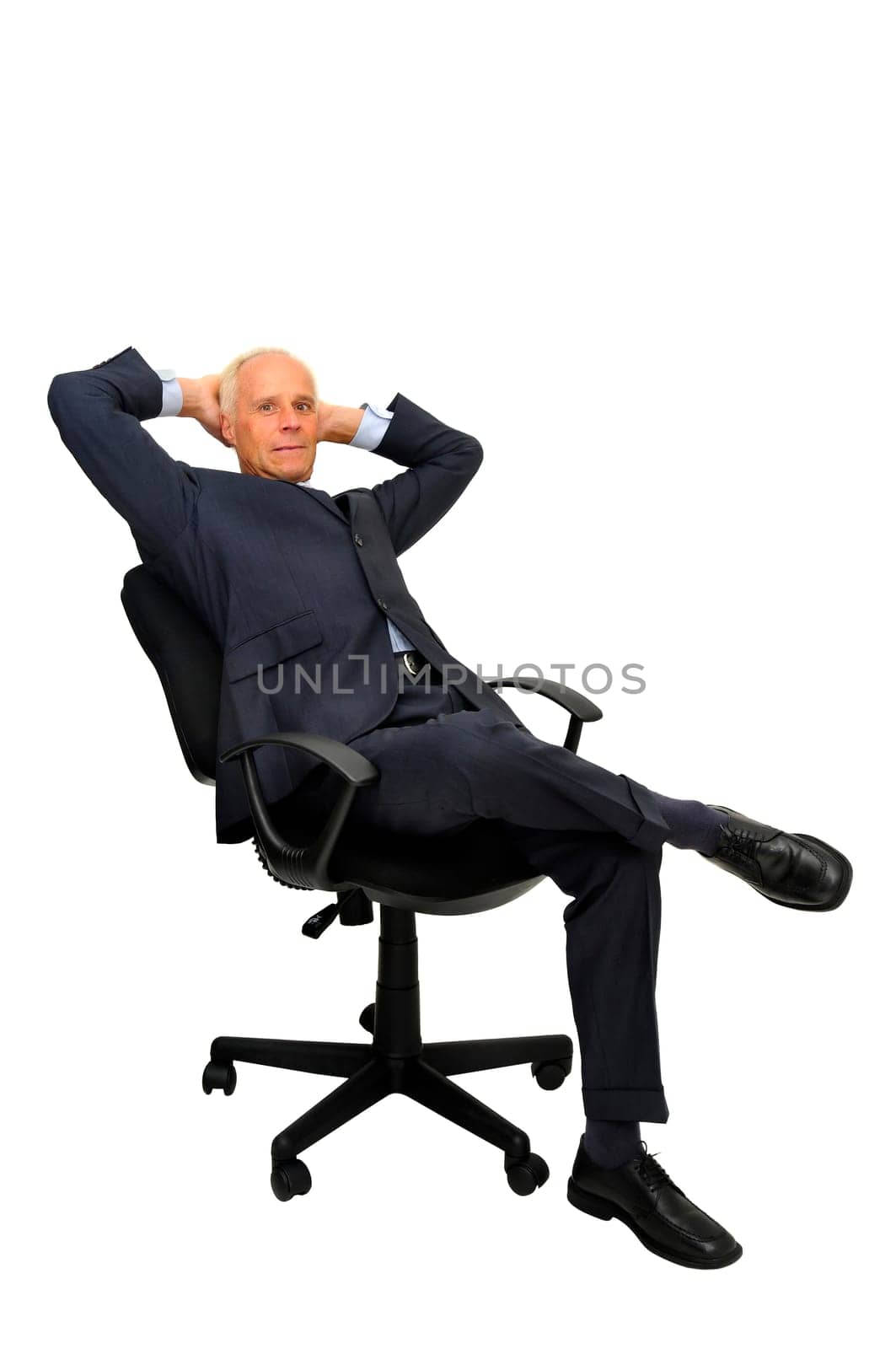 Mature businessman in a chair isolated in white