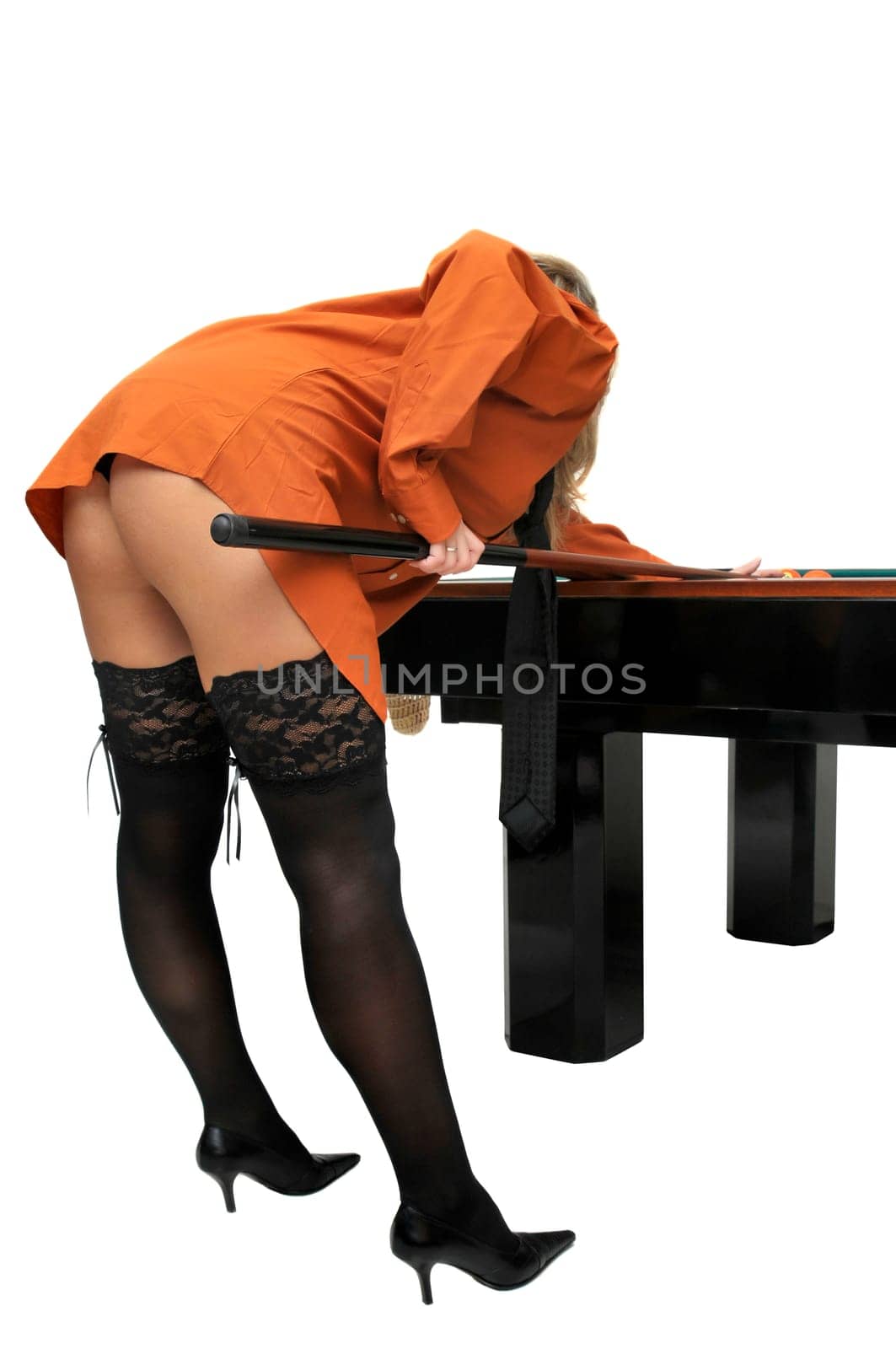 Sexy girl with man's shirt and tie playing snooker