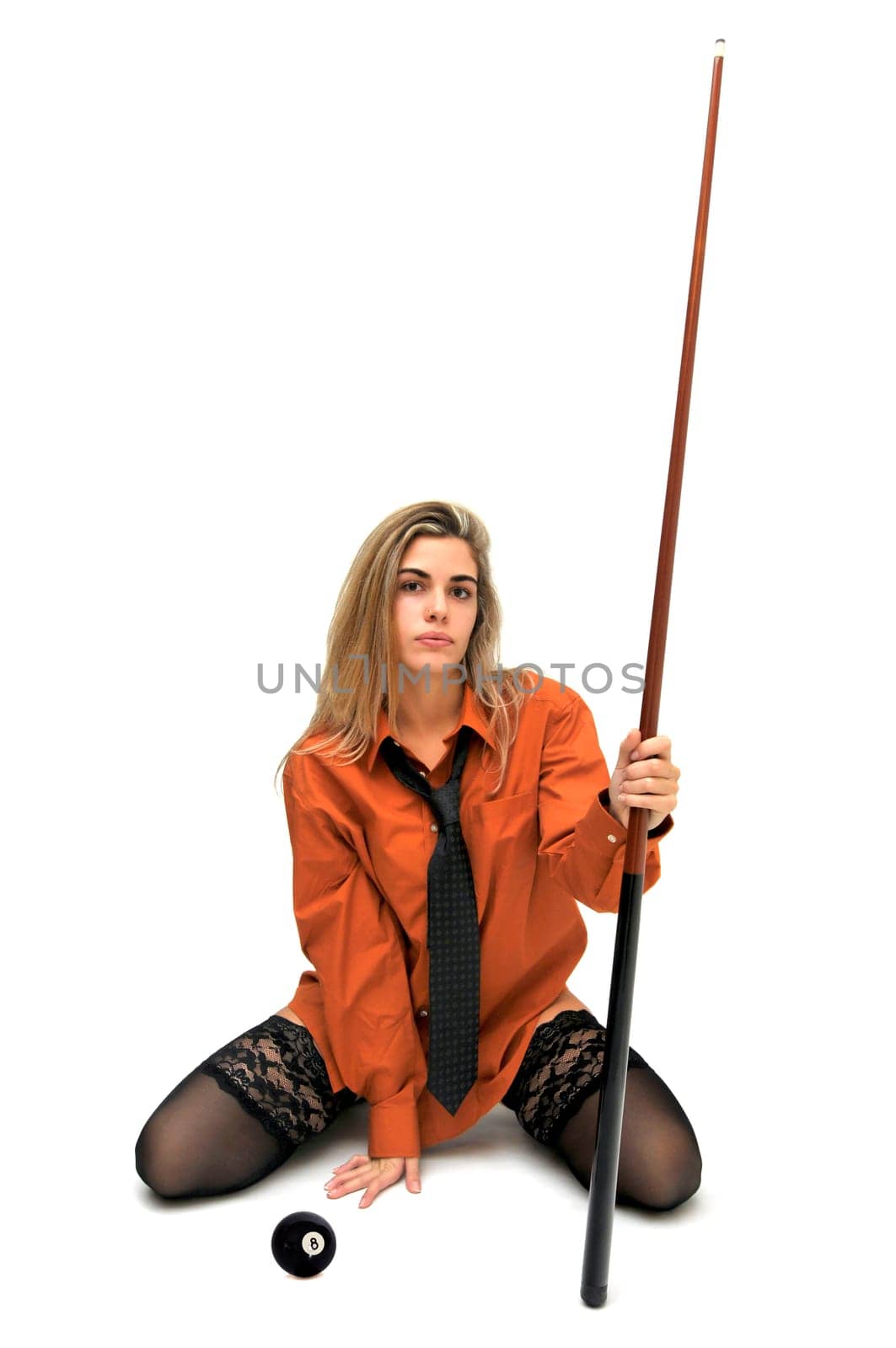 Sexy girl with man's shirt and tie holding a snooker cue