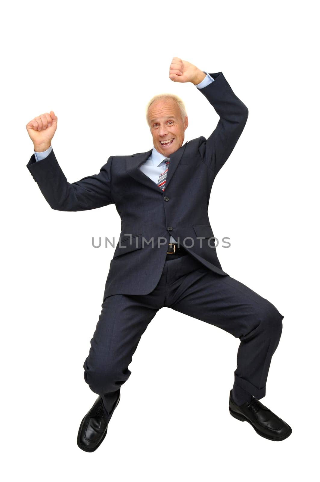 Mature businessman jumping isolated in white