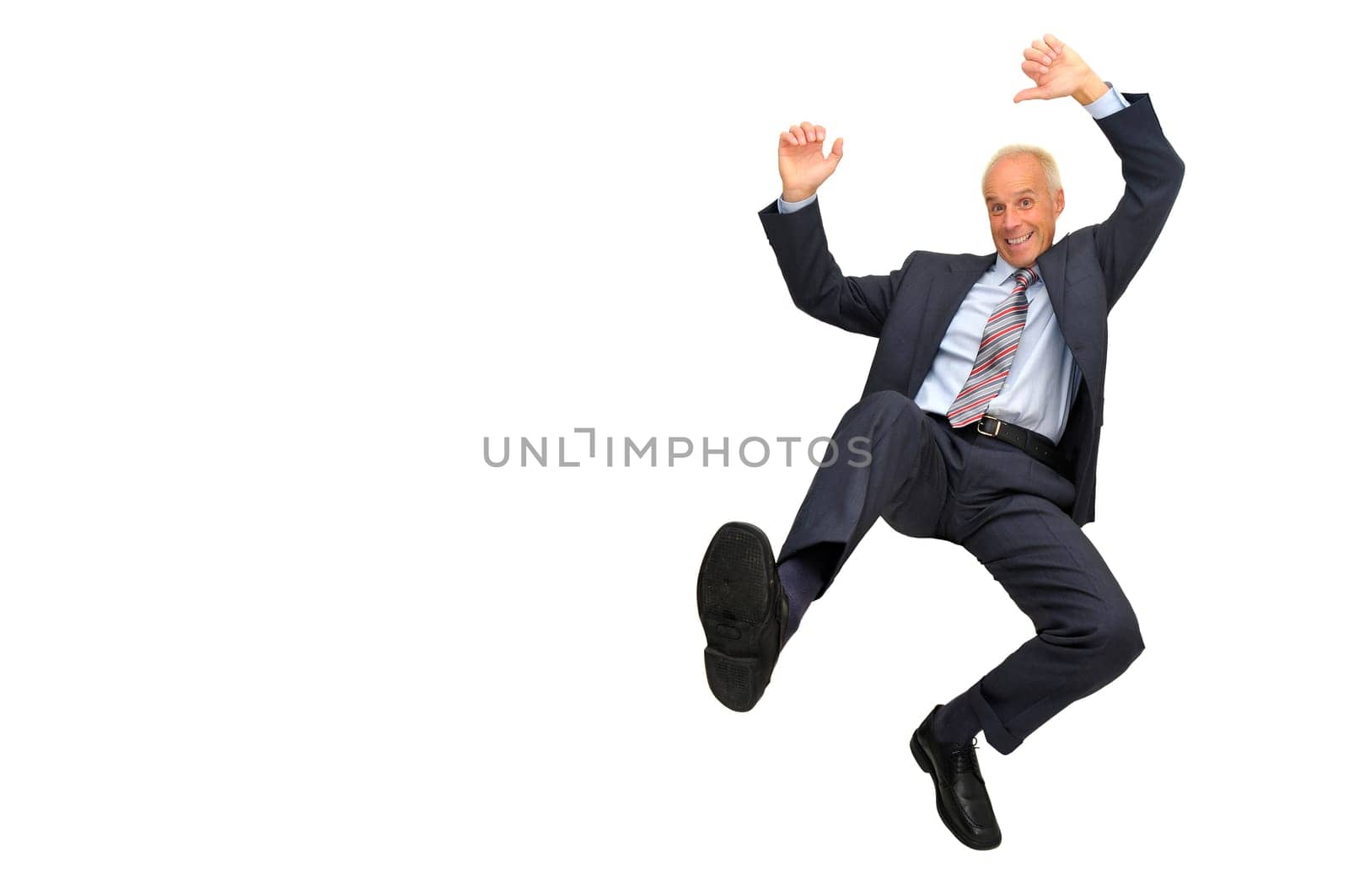 Mature businessman jumping isolated in white