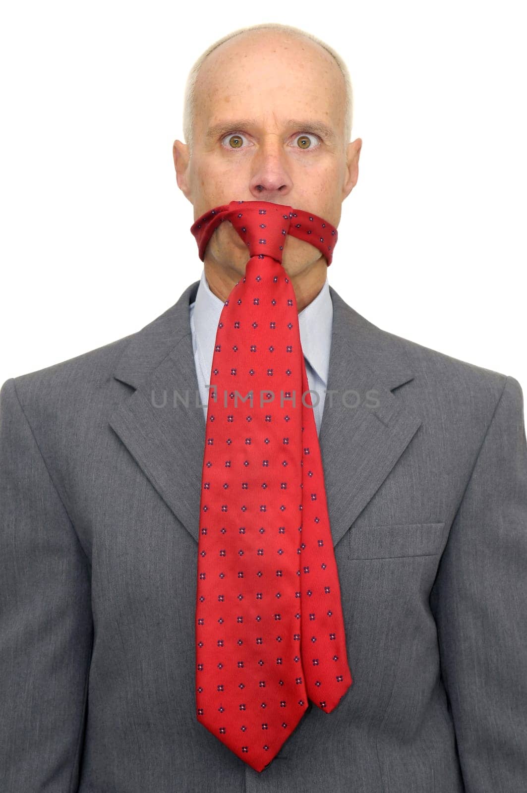 Businessman with tie in is mouth isolated against a white background