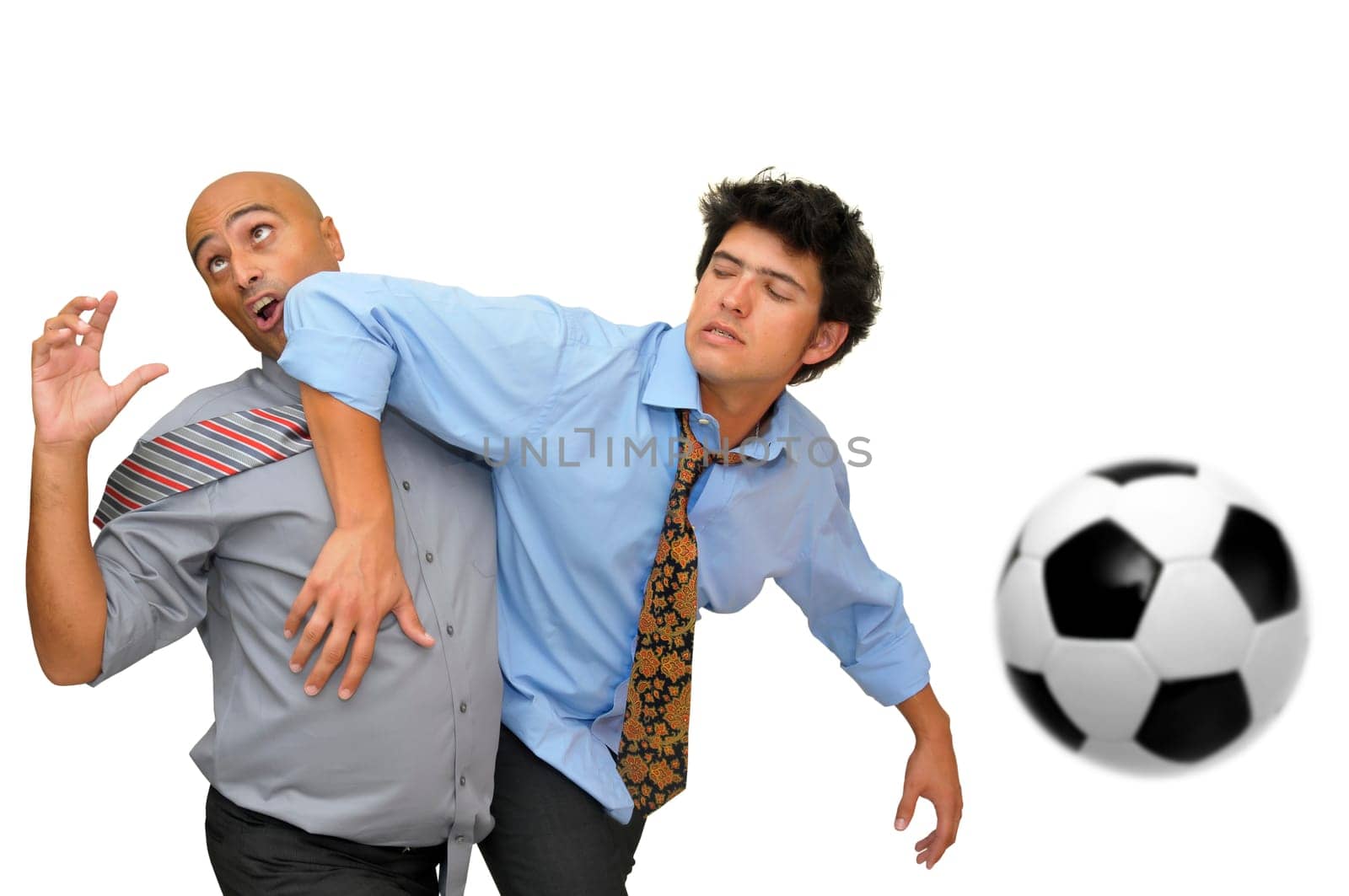 Two businessmen fighting in a soccer game isolated in white