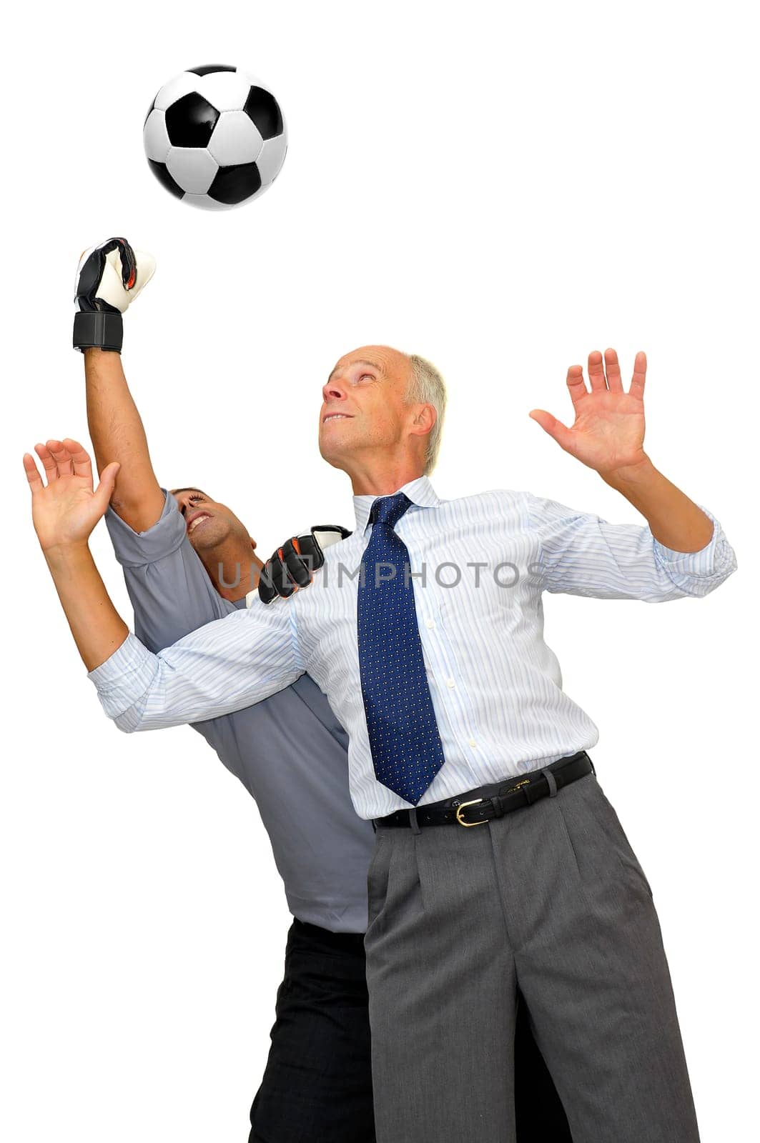 Two businessmen playing soccer isolated in white