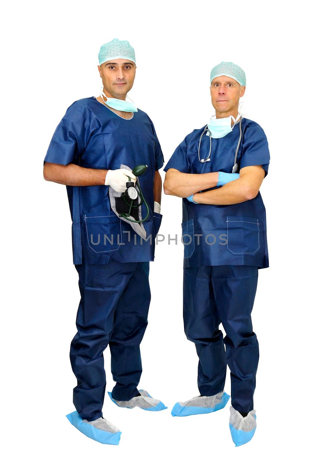 Doctors team in uniform posing isolated in white