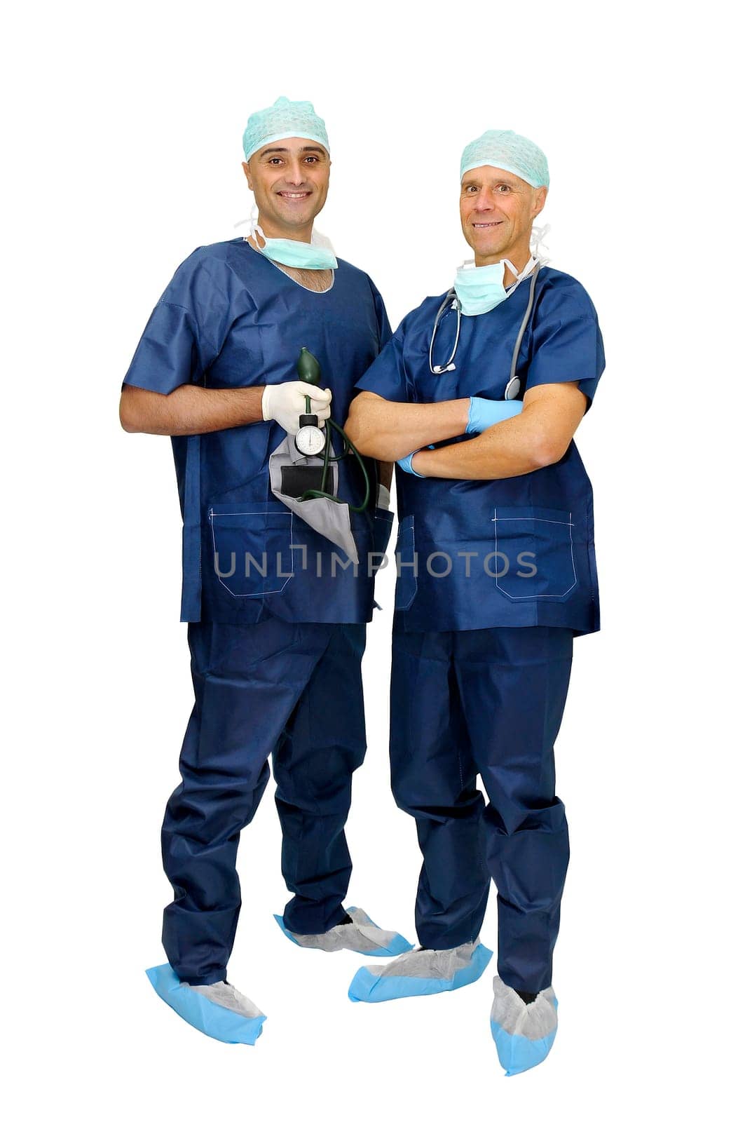 Doctors team in uniform posing isolated in white
