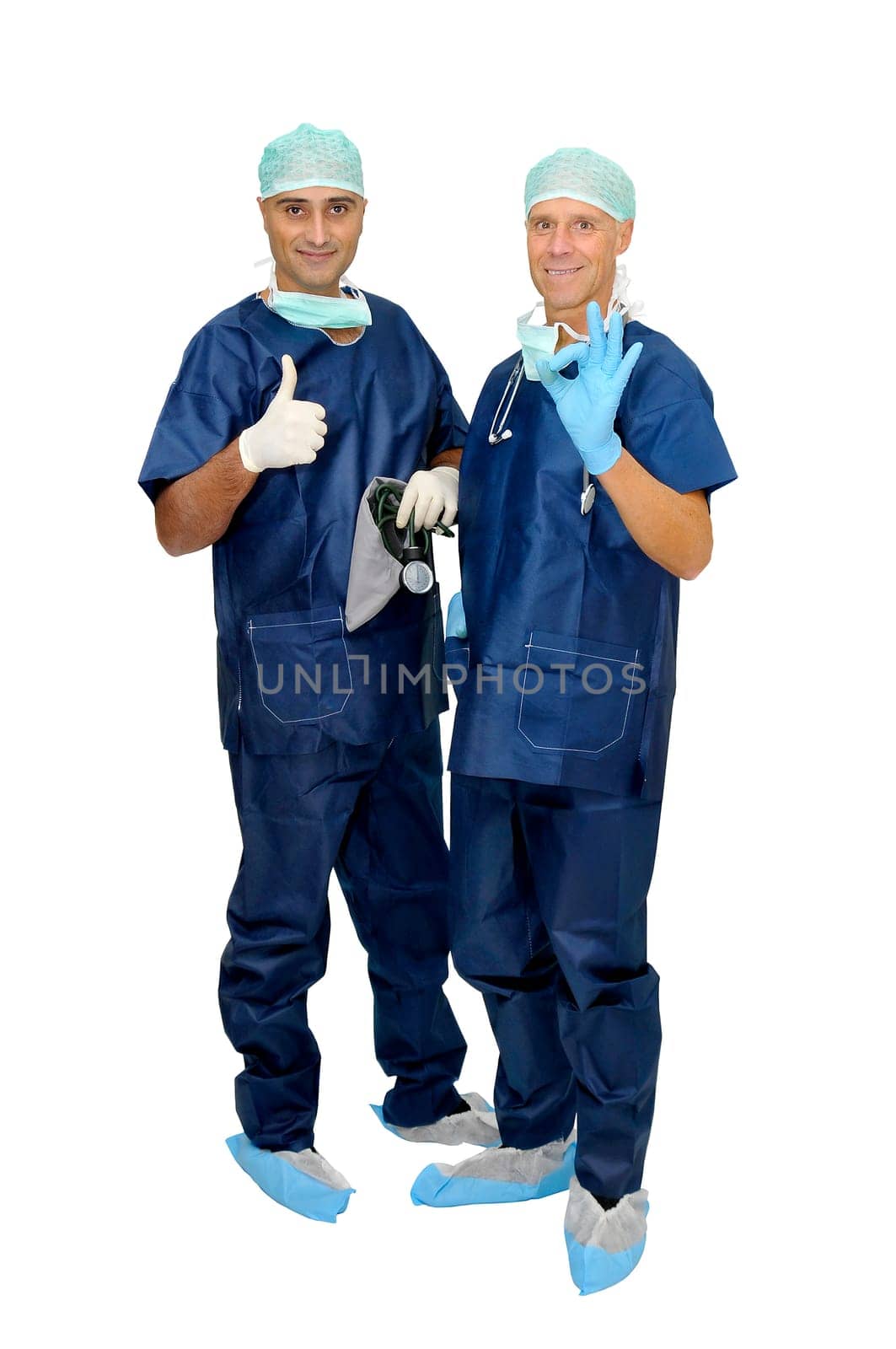 Doctors team in uniform posing isolated in white