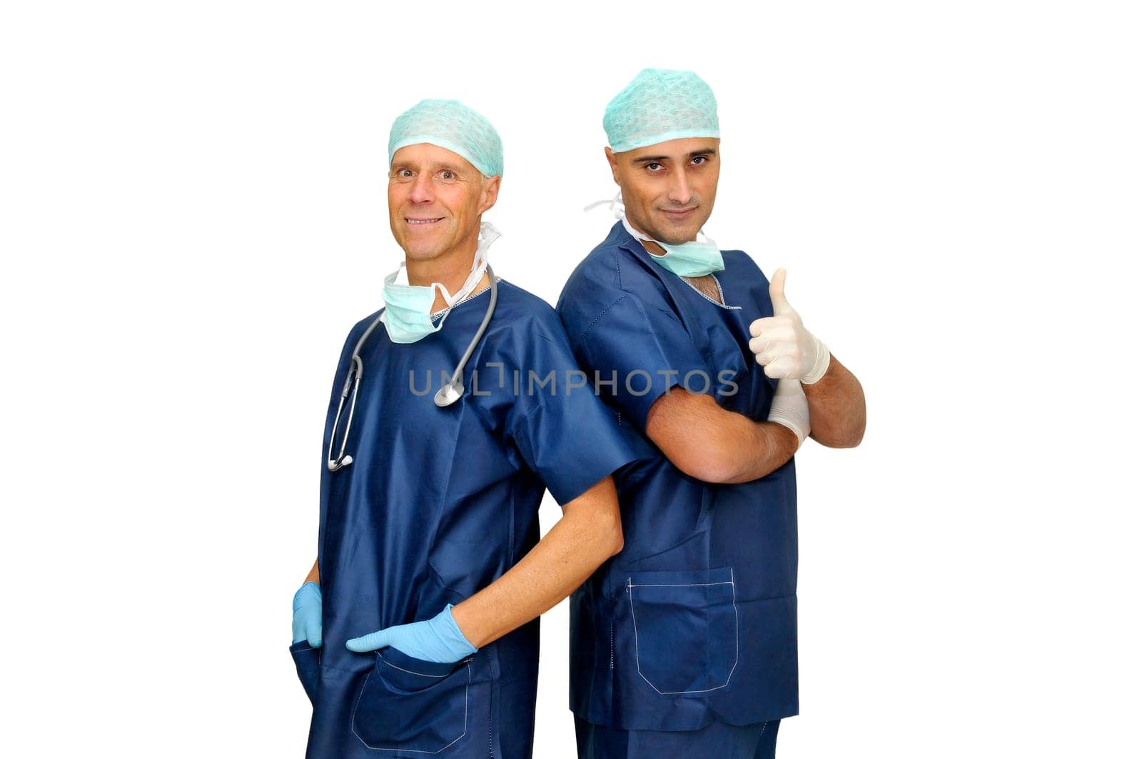 Doctors team in uniform posing isolated in white