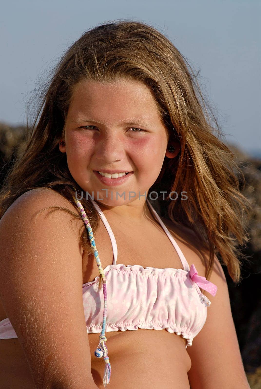 Beautiful young girl posing in the beach
