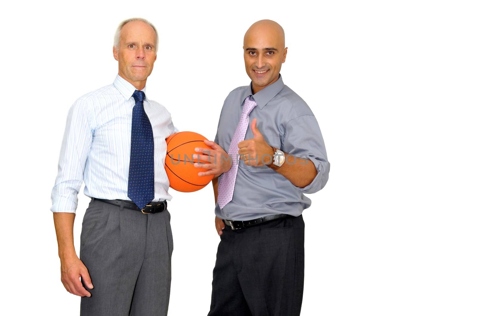 Two businessmen with a basketball isolated in white