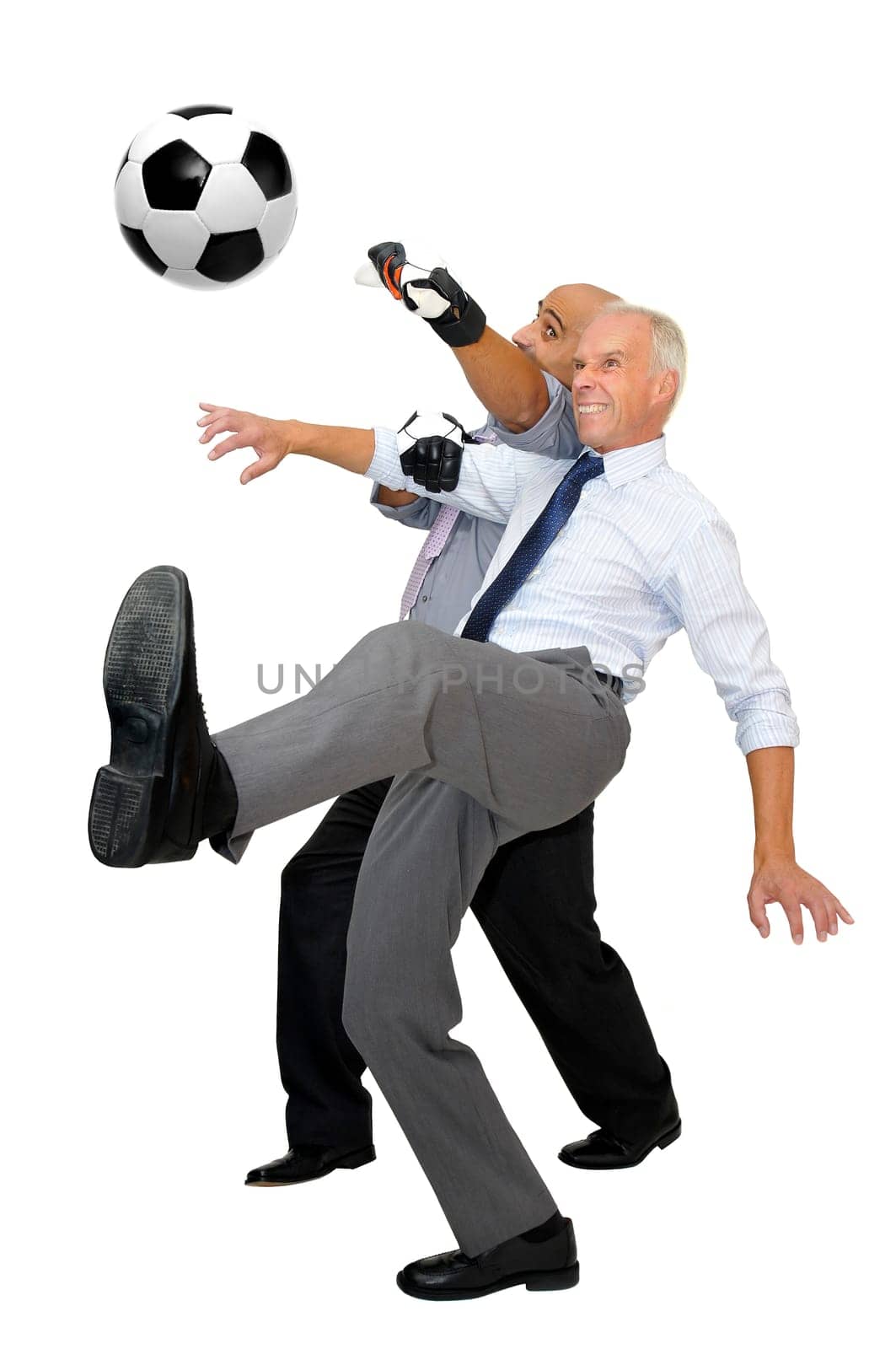 Two businessmen playing soccer isolated in white
