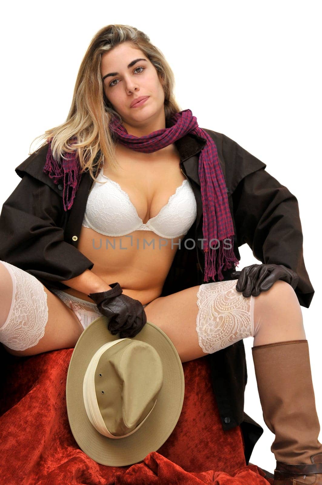 Sexy girl in cowboy outfit isolated in white