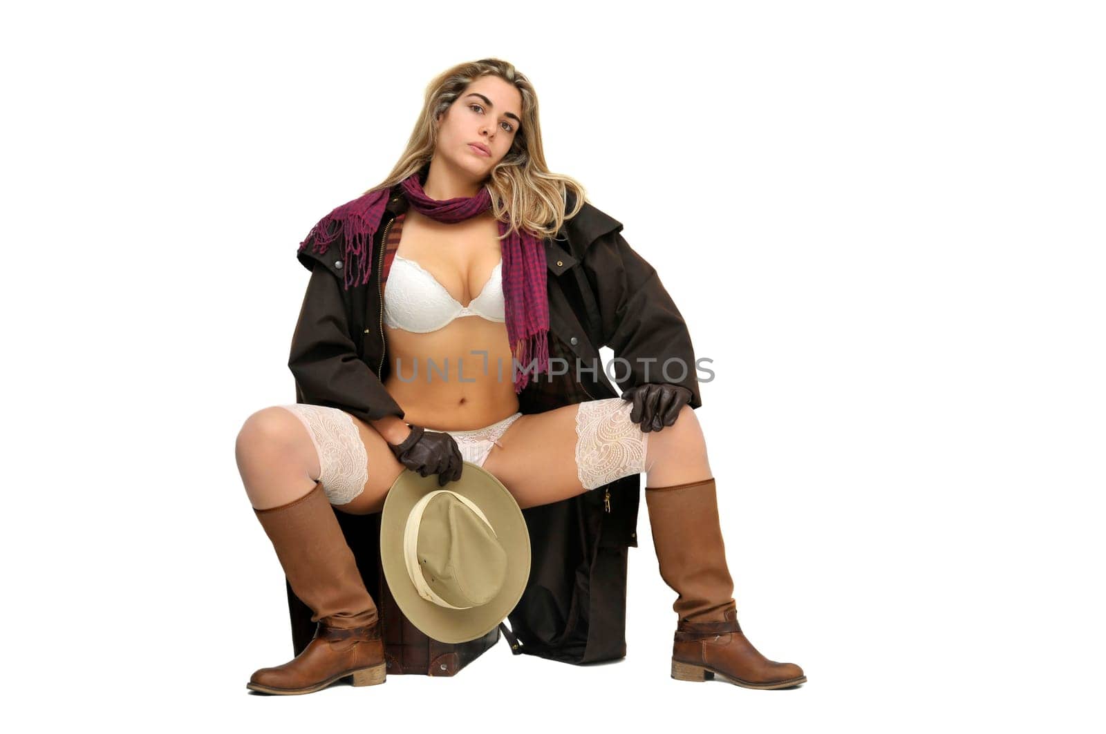 Sexy girl in cowboy outfit isolated in white