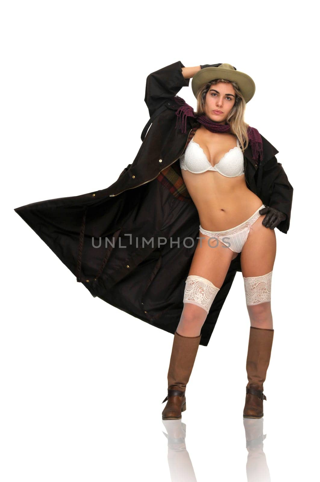 Sexy girl in cowboy outfit isolated in white