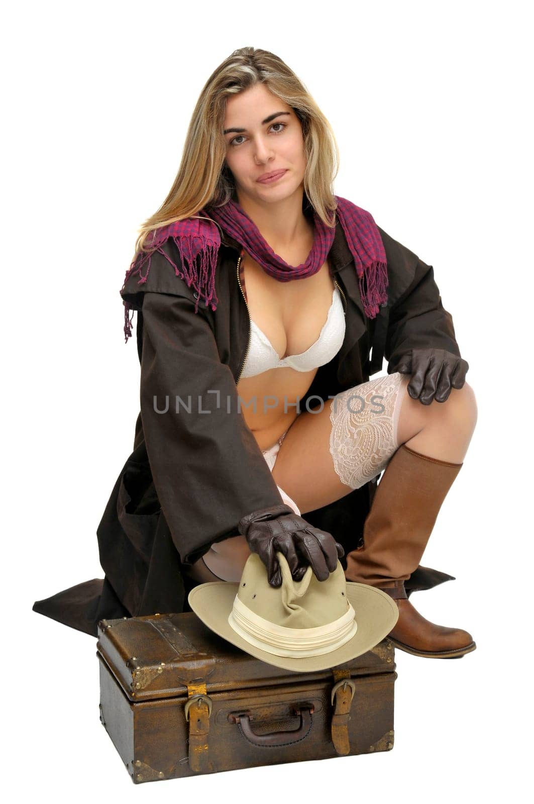 Sexy girl in cowboy outfit isolated in white