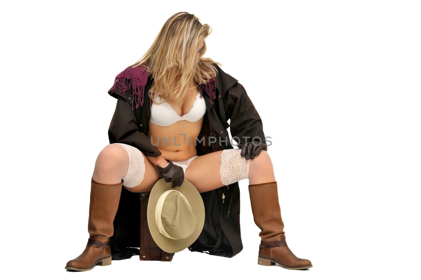 Sexy girl in cowboy outfit isolated in white