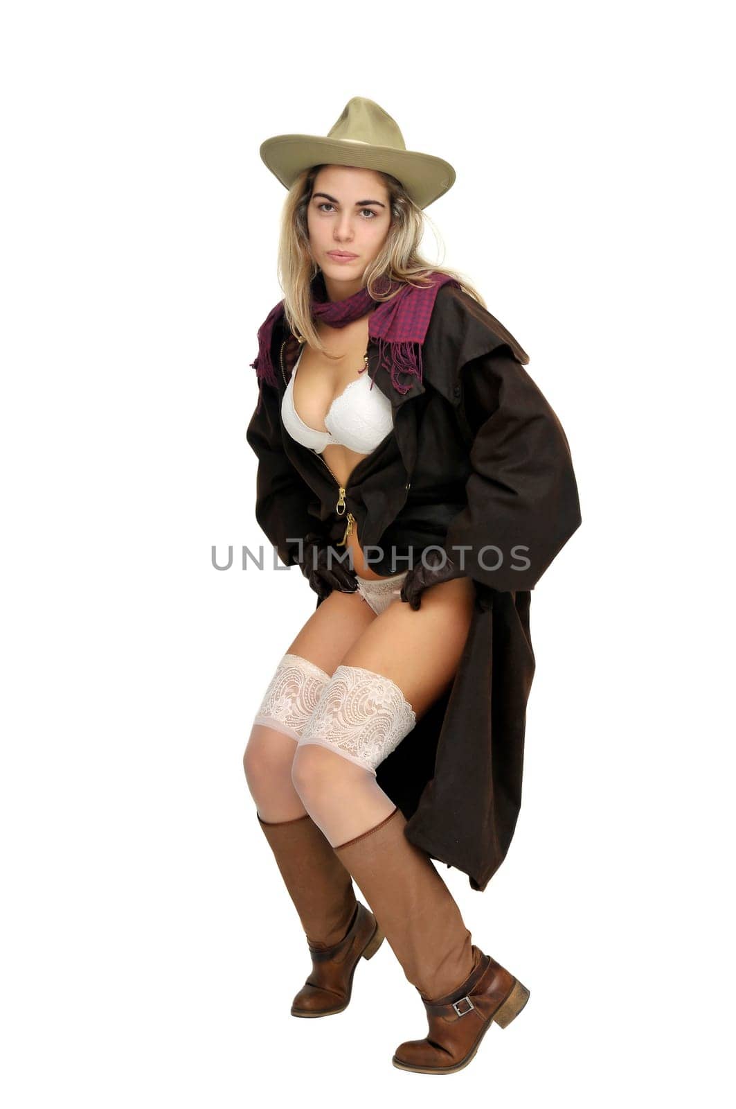 Sexy girl in cowboy outfit isolated in white