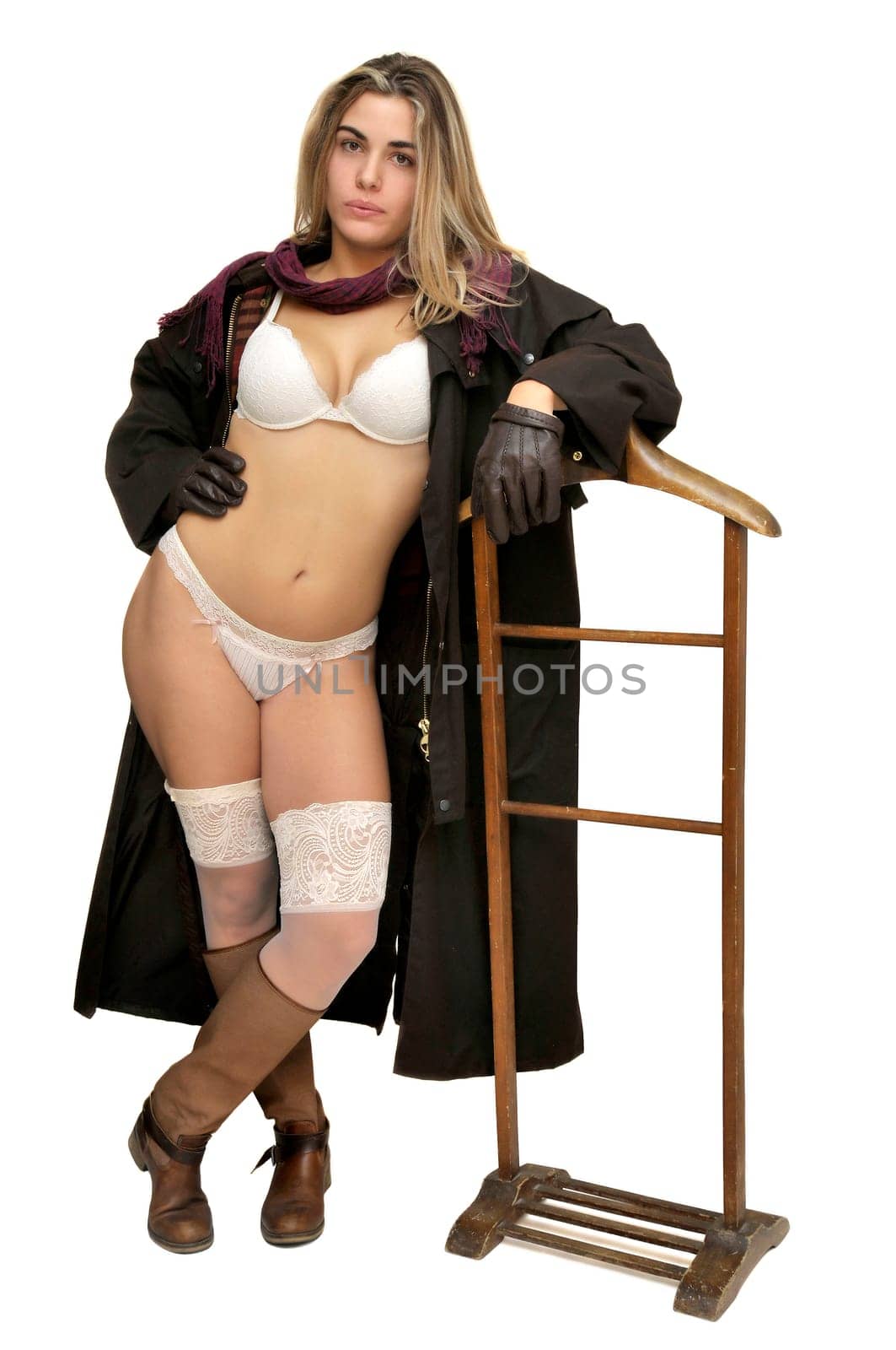 Sexy girl in cowboy outfit isolated in white