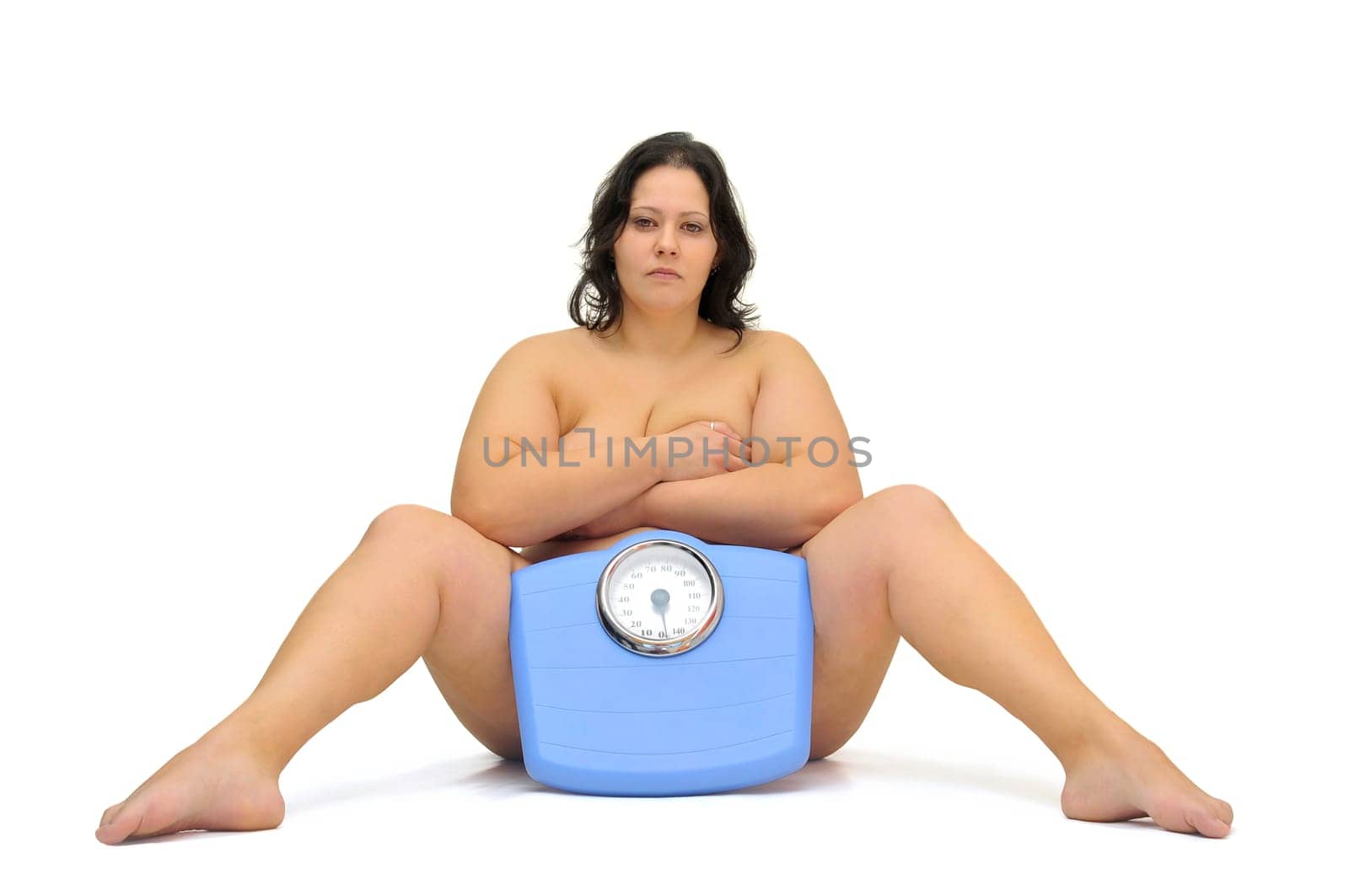 Beautiful nude large girl with weight scale isolated in white