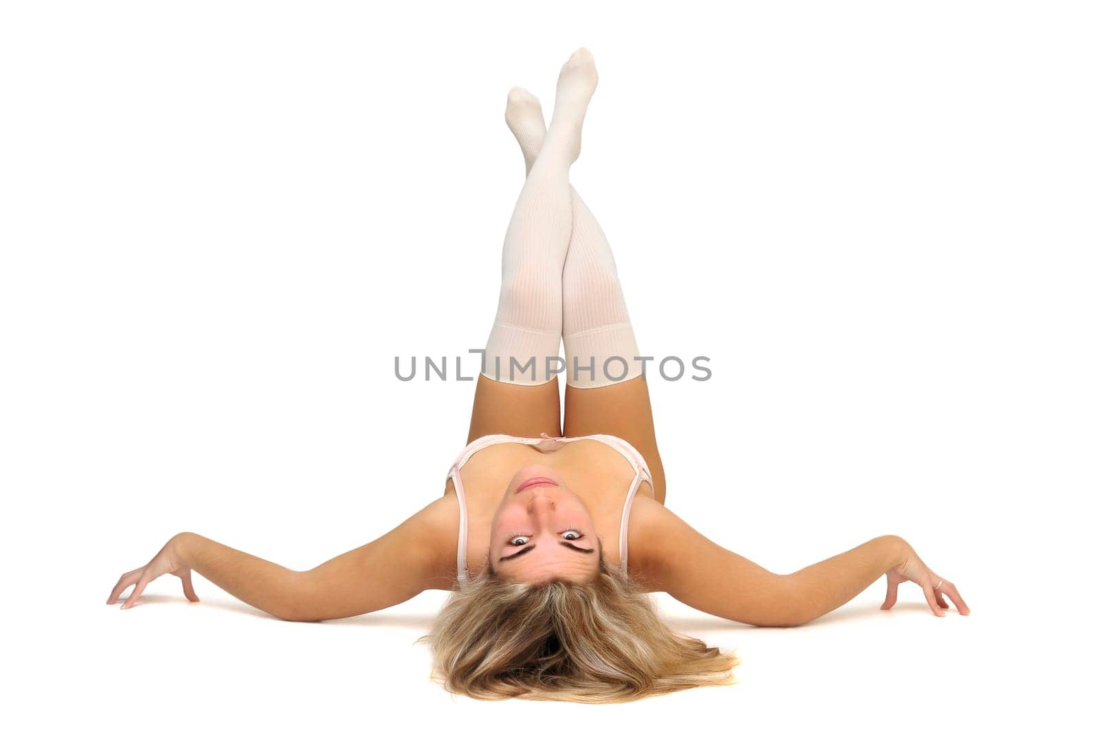 Sexy girl in white and pink lingerie posing isolated in white
