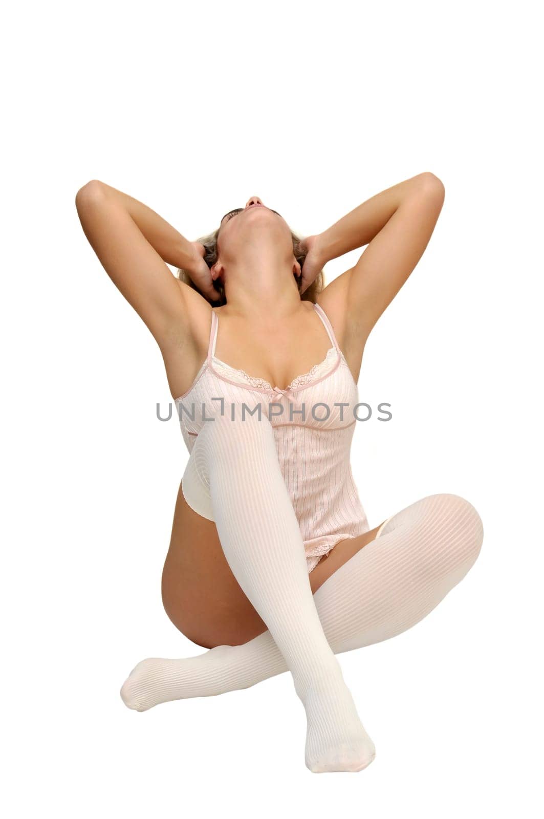 Sexy girl in white and pink lingerie posing isolated in white