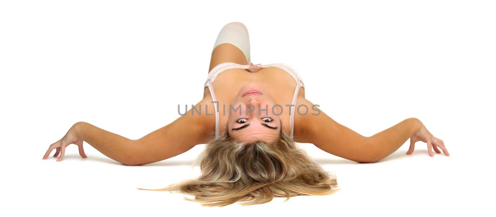 Sexy girl in white and pink lingerie posing isolated in white