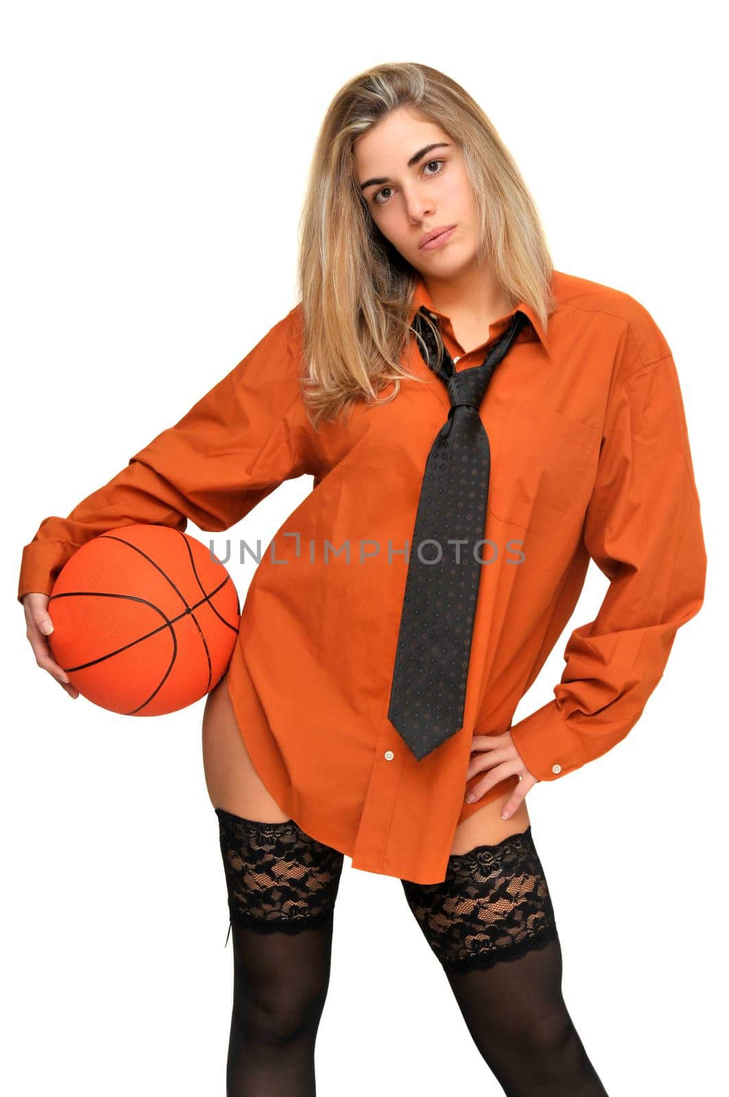 Sexy girl with man's shirt and tie holding a basketball
