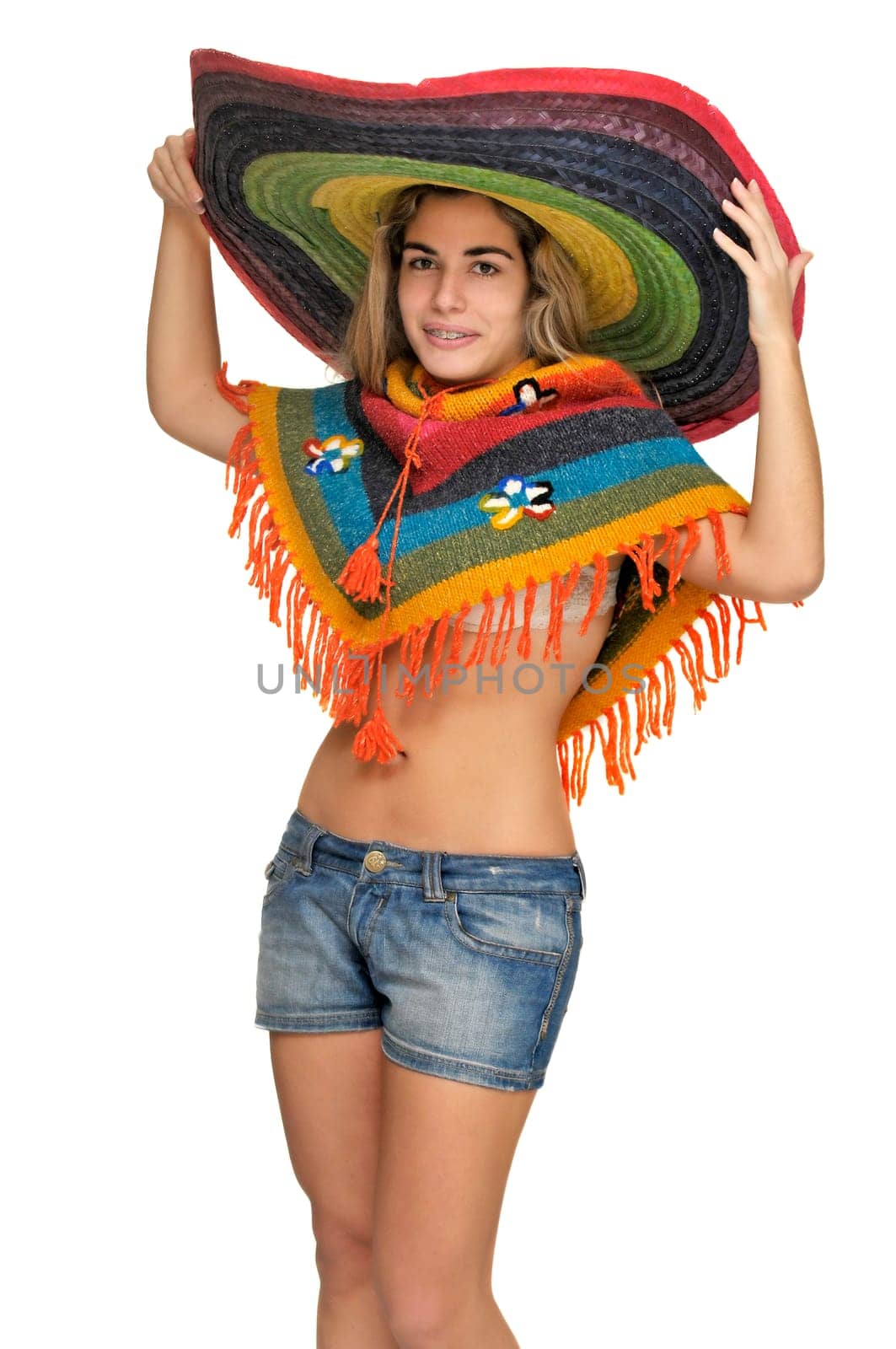 Sexy girl posing with a big sombrero hat isolated in white