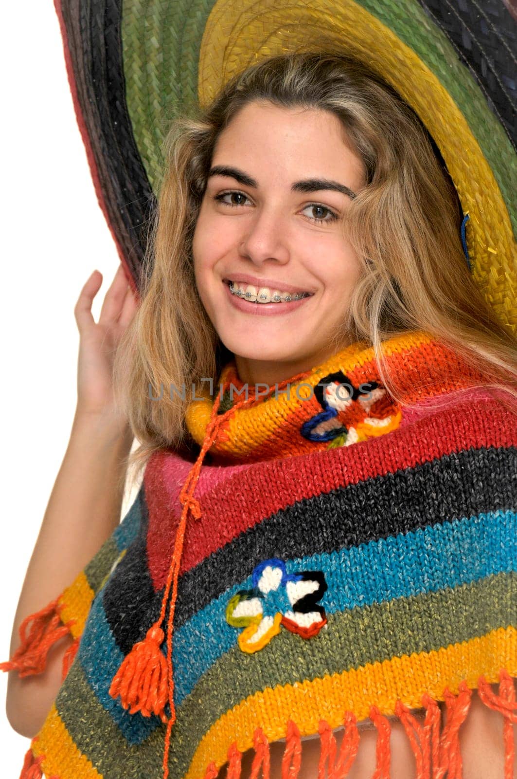 Sexy girl posing with a big sombrero hat isolated in white