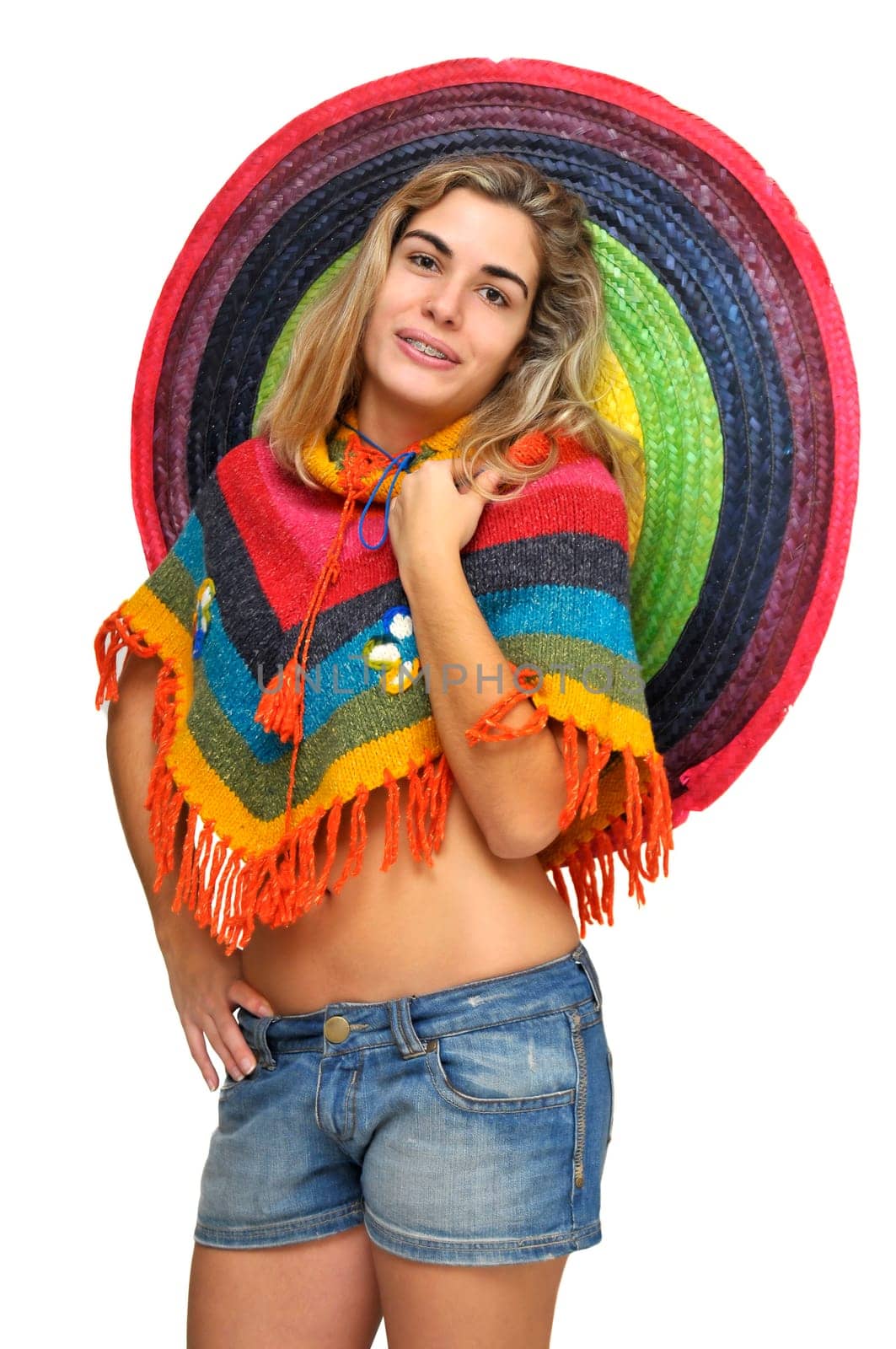 Sexy girl posing with a big sombrero hat isolated in white