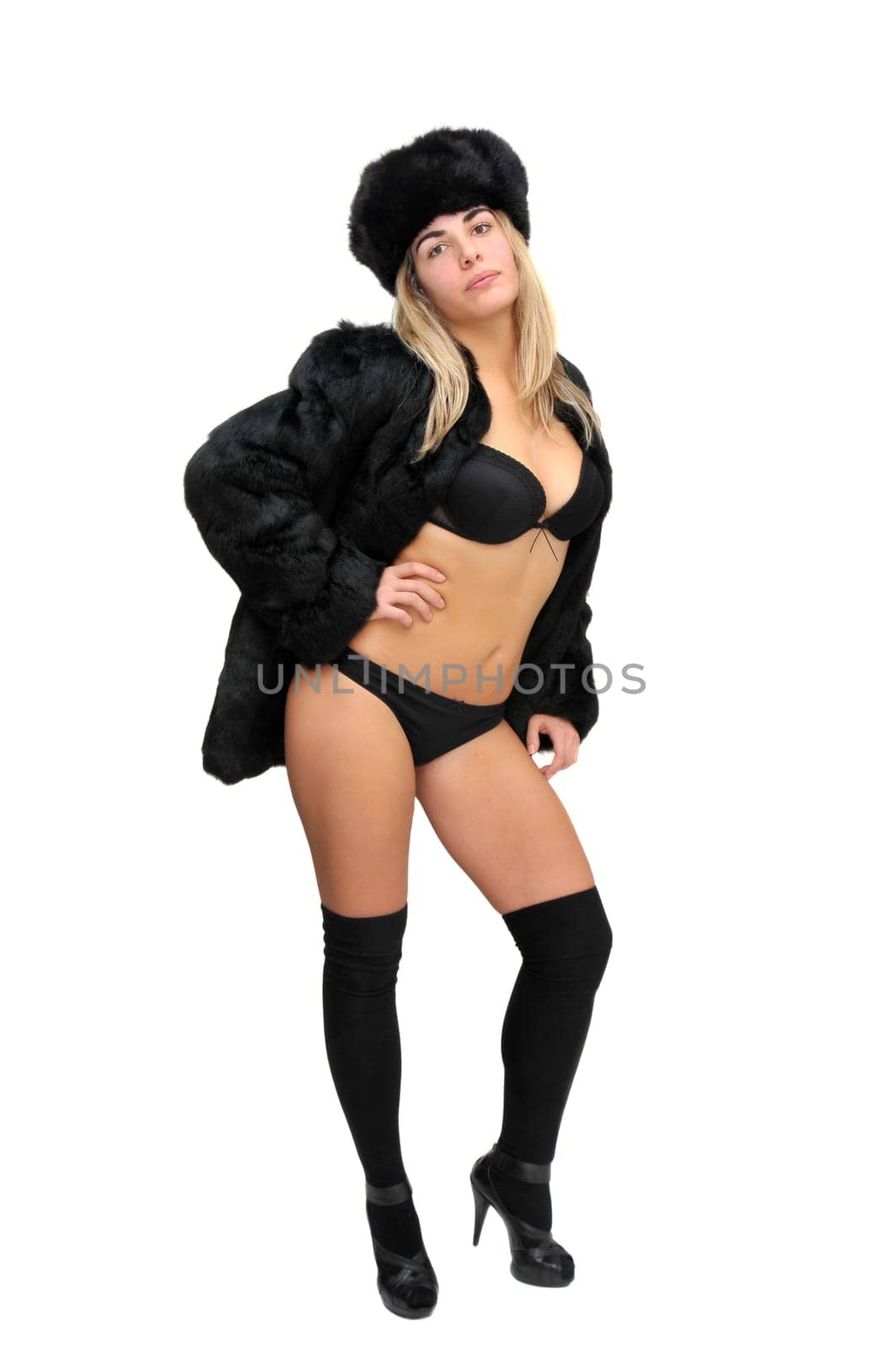 Sexy girl in furs and black lingerie isolated in white