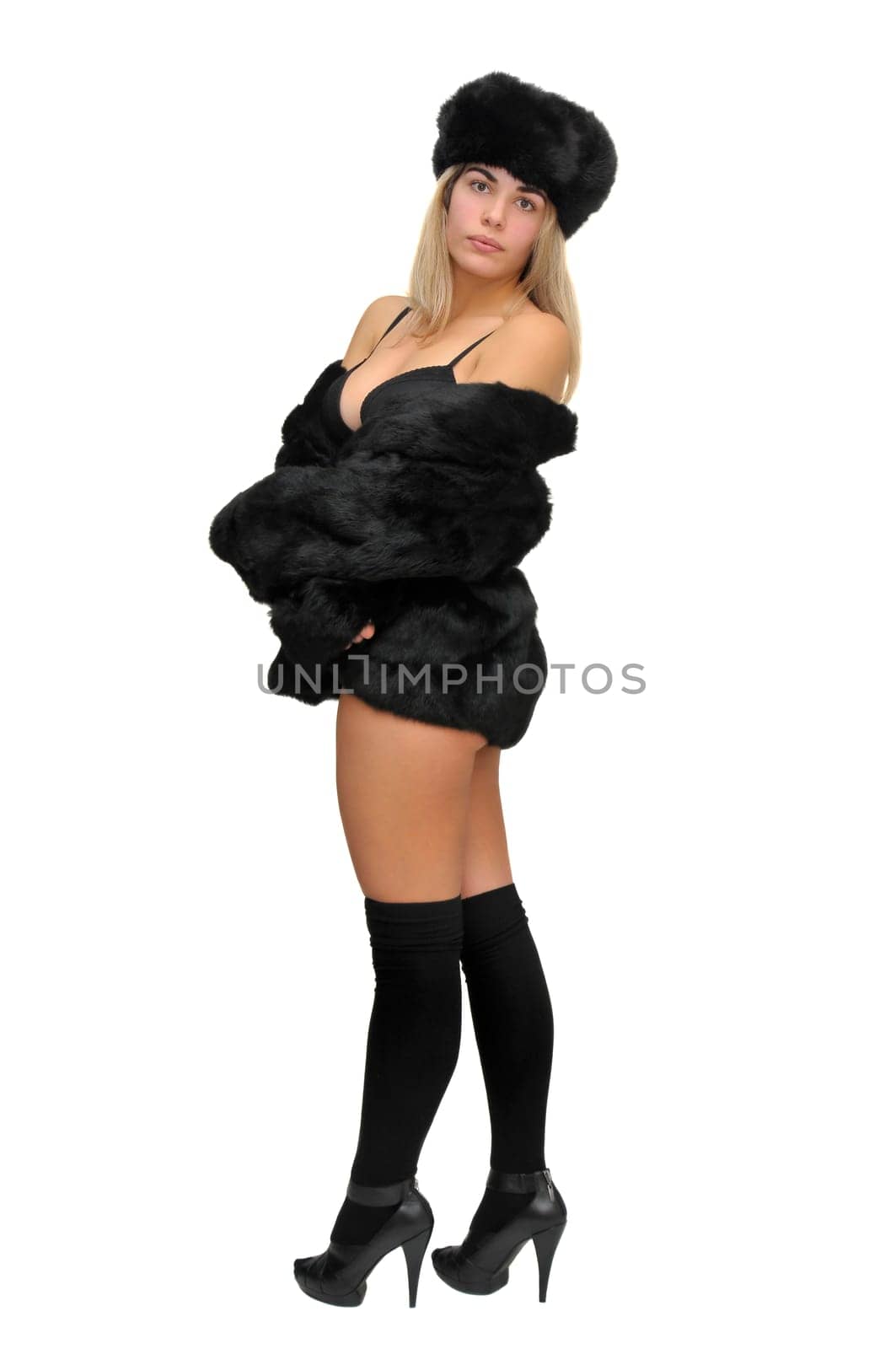 Sexy girl in furs and black lingerie isolated in white