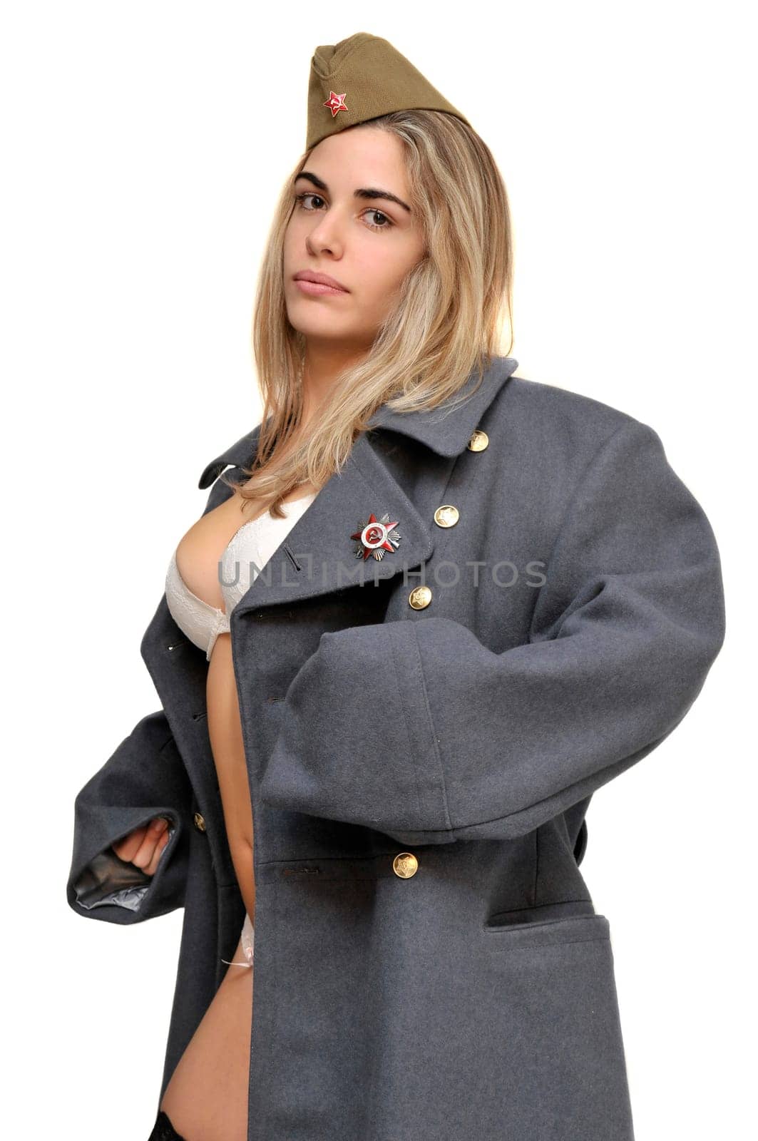 Sexy girl in russian army greatcoat and lingerie isolated in white