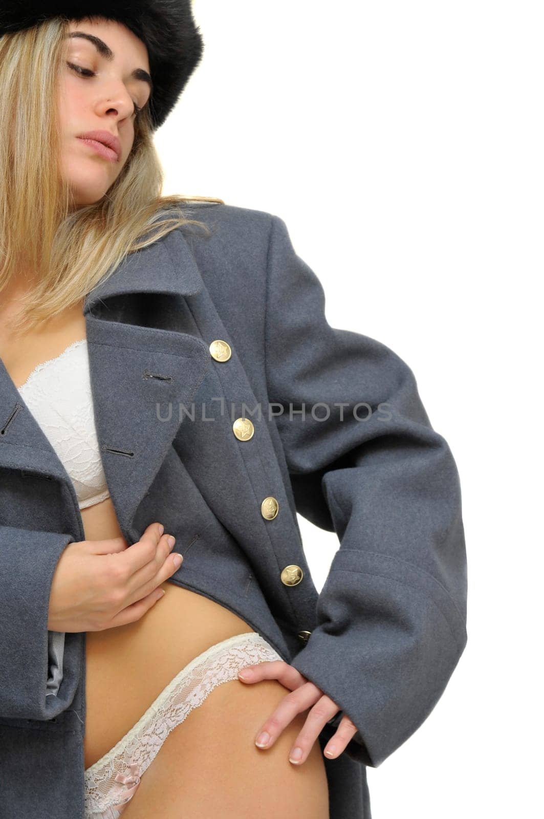 Sexy girl in russian army greatcoat and lingerie isolated in white