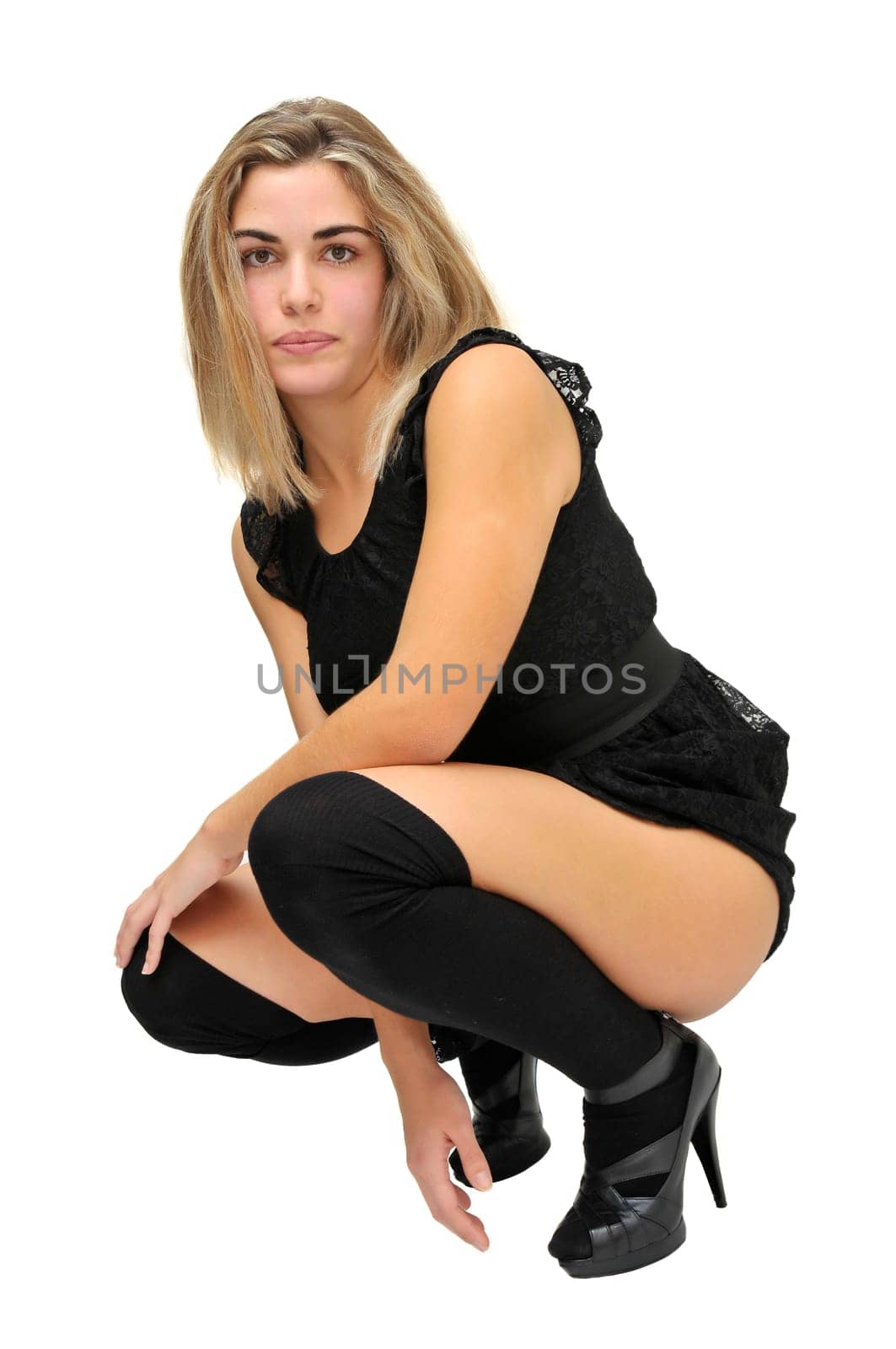 Sexy girl in a black dress isolated in white