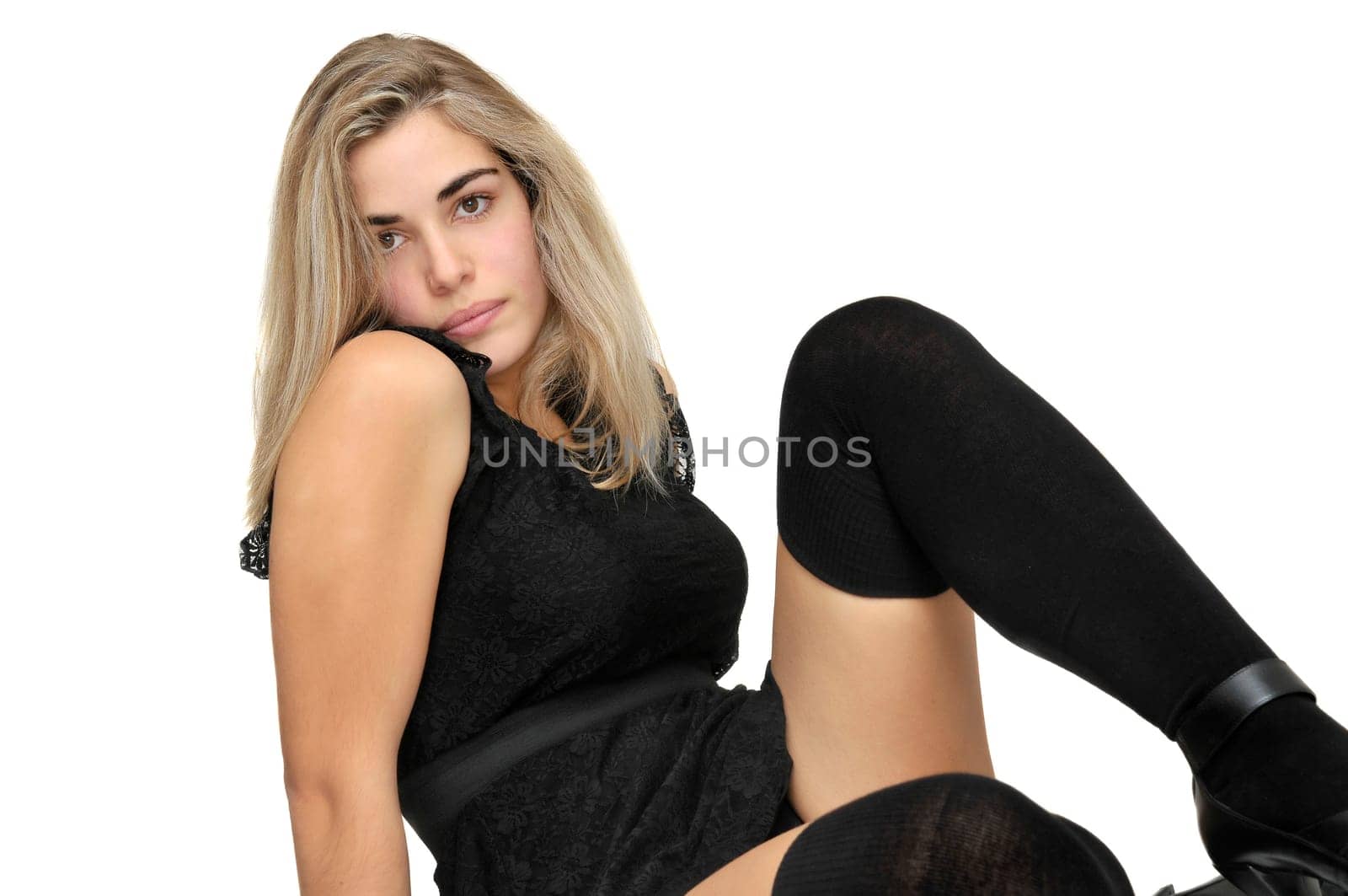 Sexy girl in a black dress isolated in white