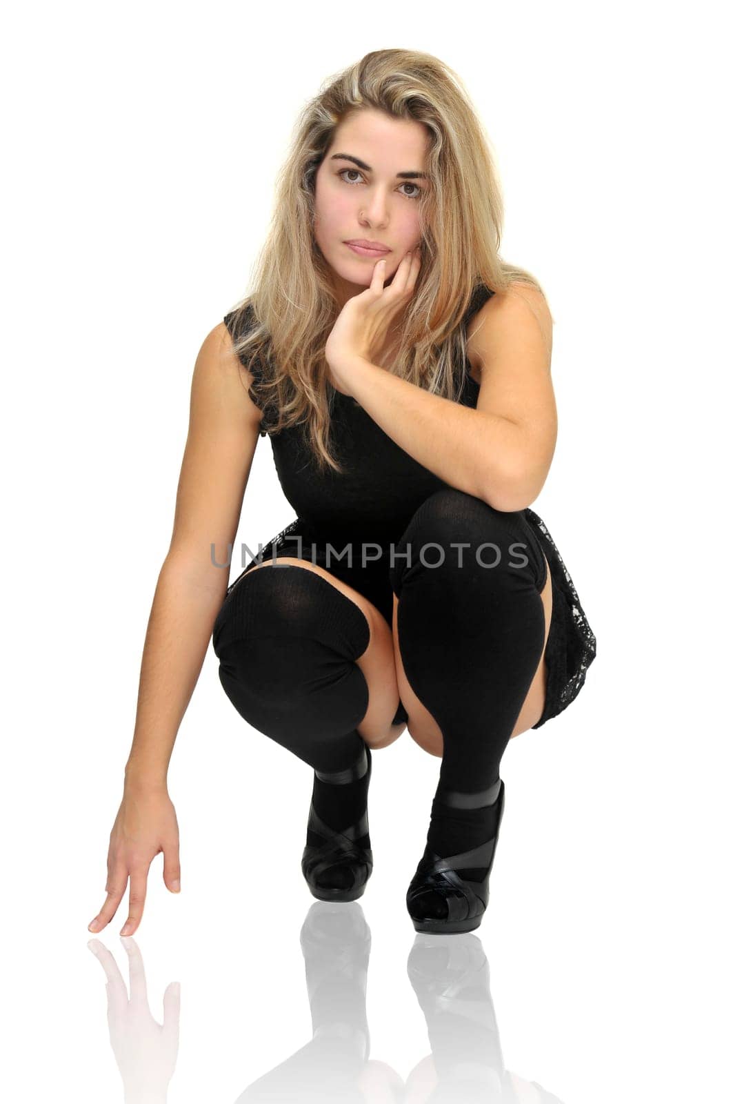 Sexy girl in a black dress isolated in white