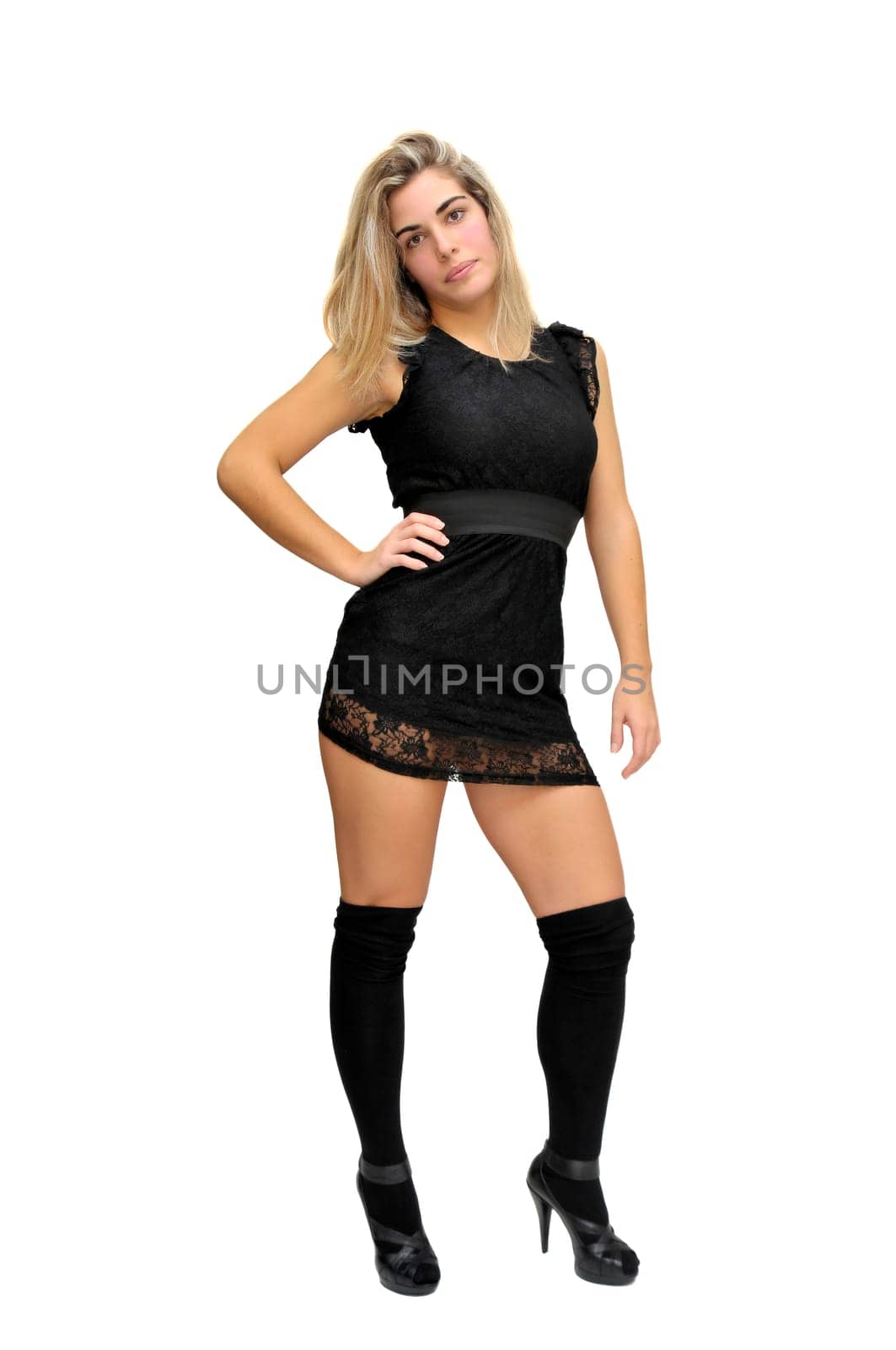 Sexy girl in a black dress isolated in white