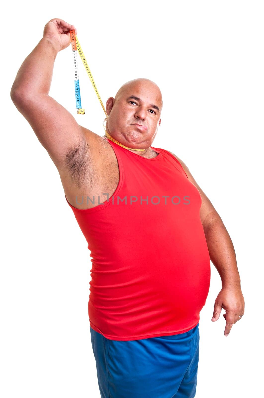 Large desperate man hanging himself with a measuring tape isolated in white