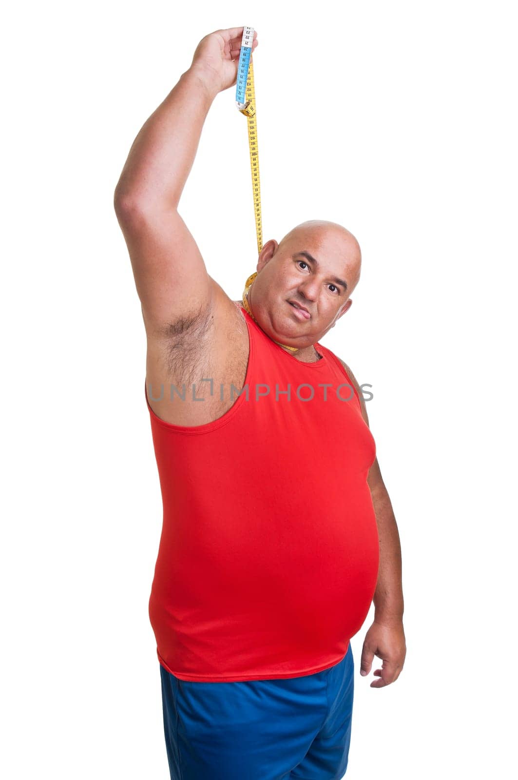 Large desperate man hanging himself with a measuring tape isolated in white