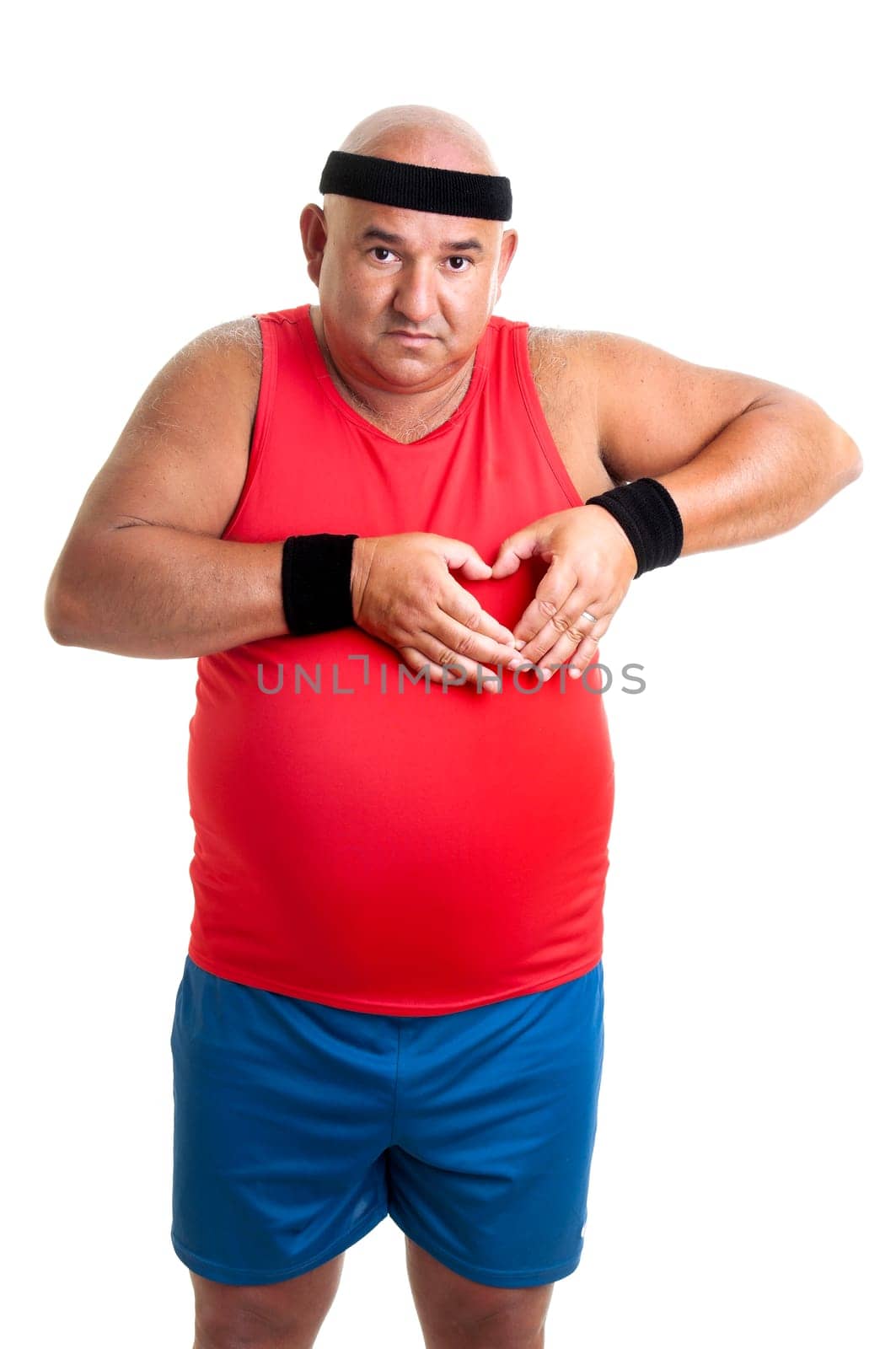Large fitness man making a heart with his hands isolated in white