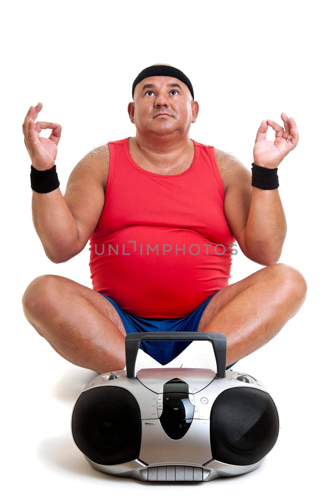 Large fitness man doing yoga exercices isolated in white