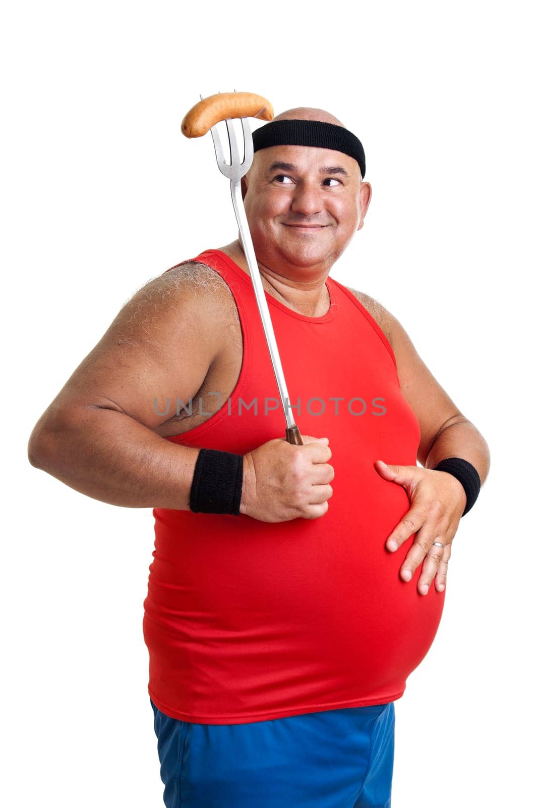 Large fitness man looking at a big sausage isolated in white