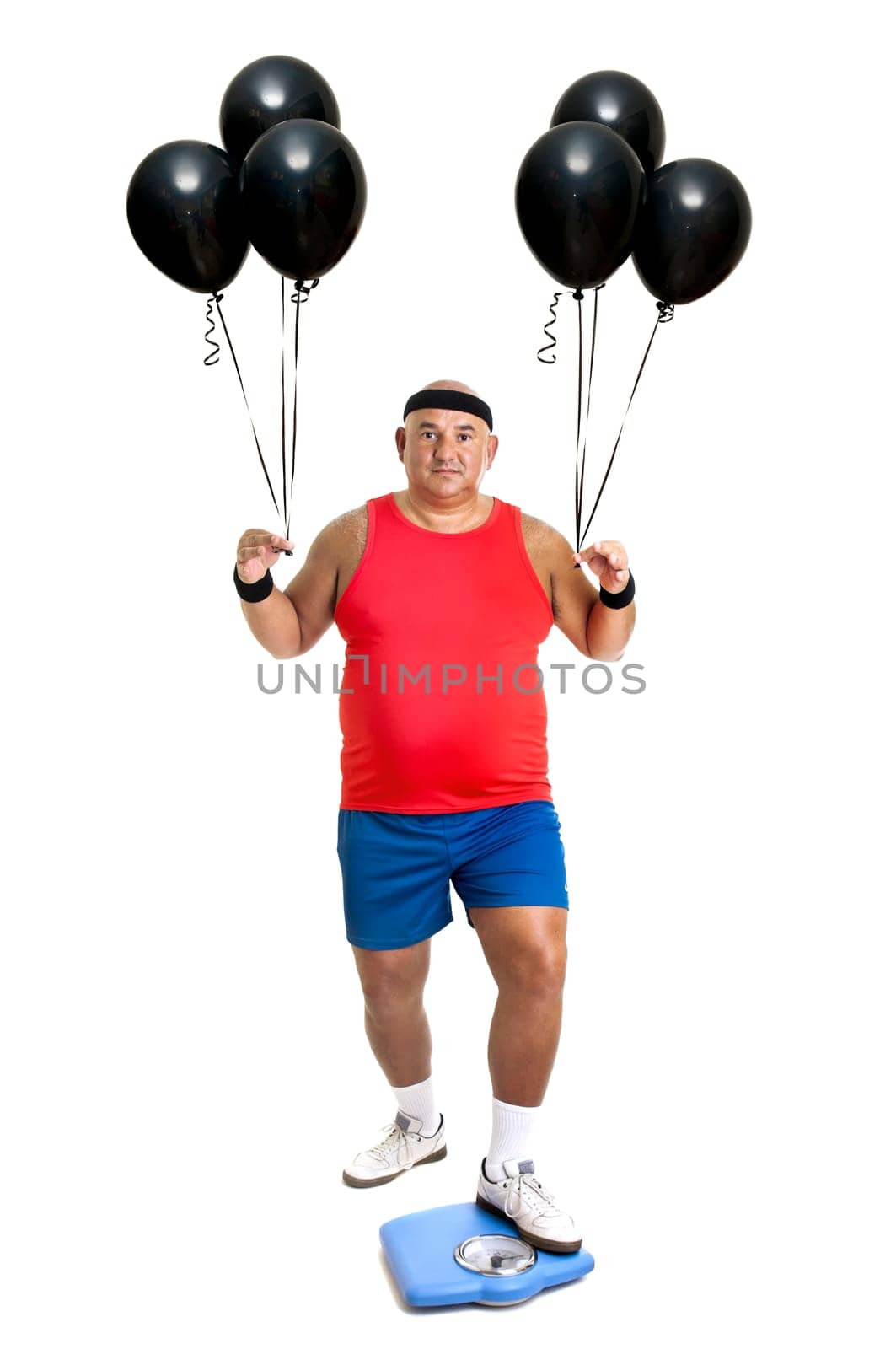 Large fitness man with weight scale and balloons isolated in white
