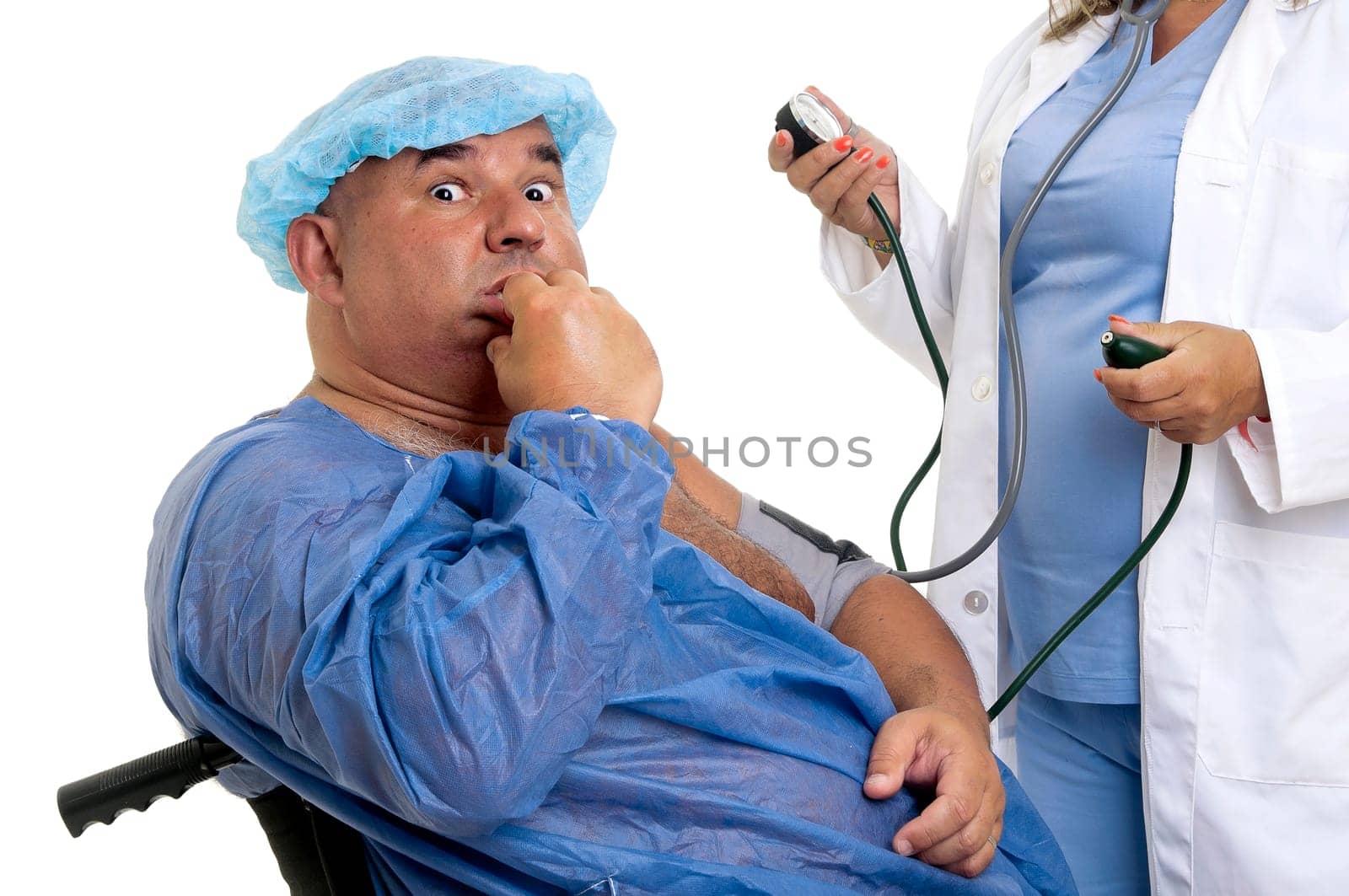 Large male patient in a wheelchair with doctor