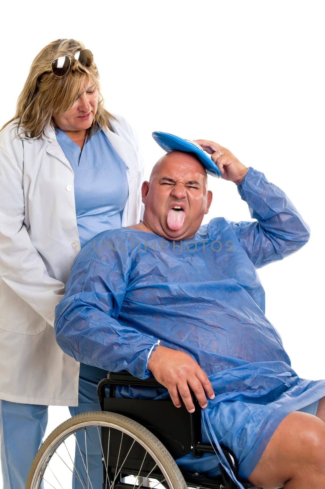Large male patient in a wheelchair with doctor